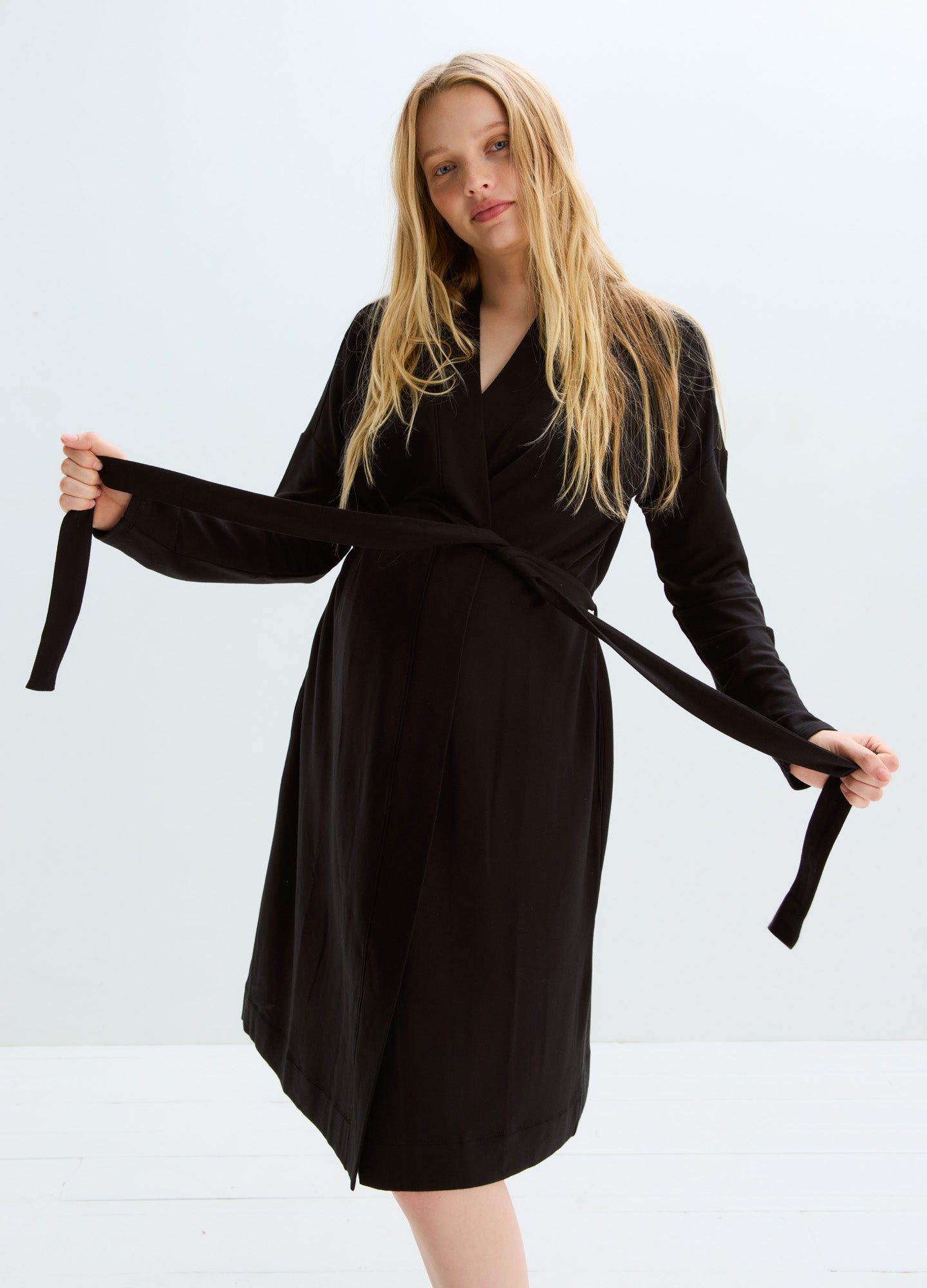 Black knee-length maternity robe with long sleeves and waist tie belt.
