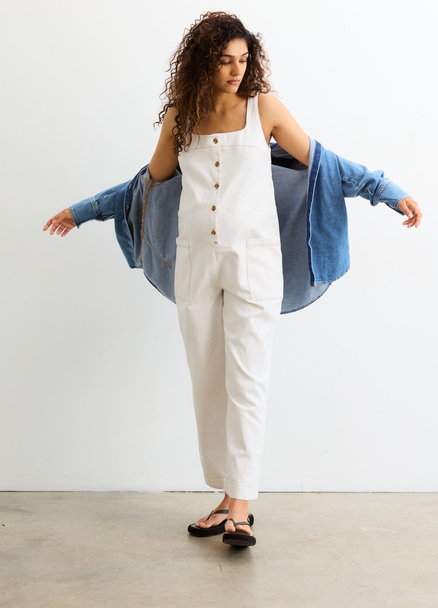 The Ryland Jumper - Chalk-colored maternity jumper with front buttons and wide straps, styled for nursing and postpartum comfort.