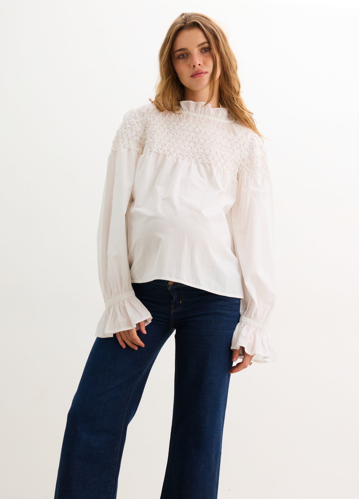 The Scarlett Smocked Top - Ivory maternity top with smocked bodice, long bishop sleeves, and nursing-friendly design.