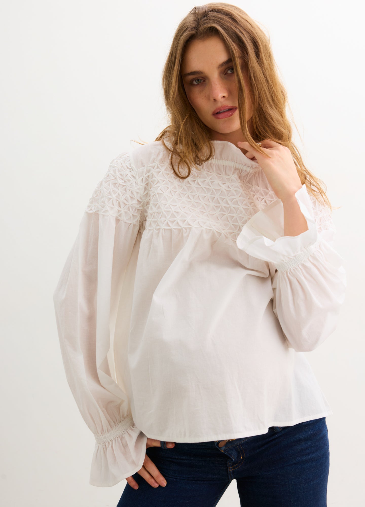 The Scarlett Smocked Top - Ivory maternity top with smocked bodice, long bishop sleeves, and nursing-friendly design.