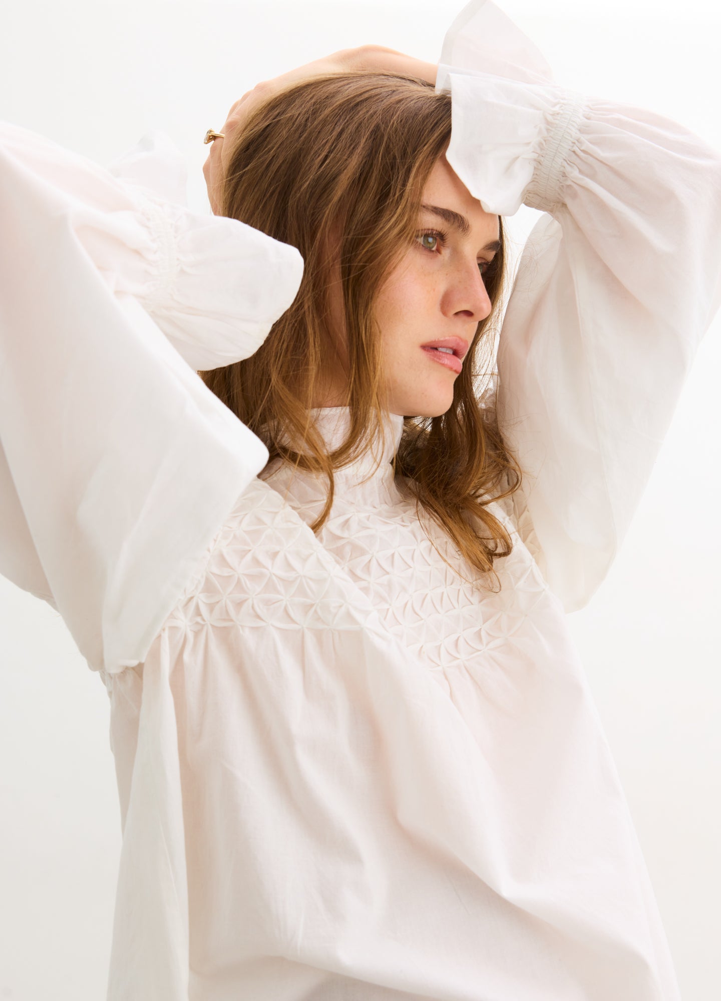 The Scarlett Smocked Top - Ivory maternity top with smocked bodice, long bishop sleeves, and nursing-friendly design.