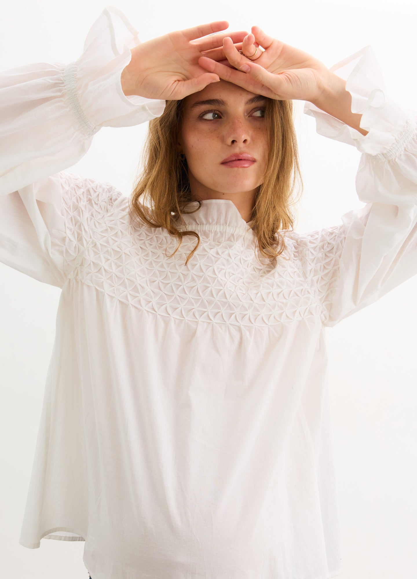 The Scarlett Smocked Top - Ivory maternity top with smocked bodice, long bishop sleeves, and nursing-friendly design.