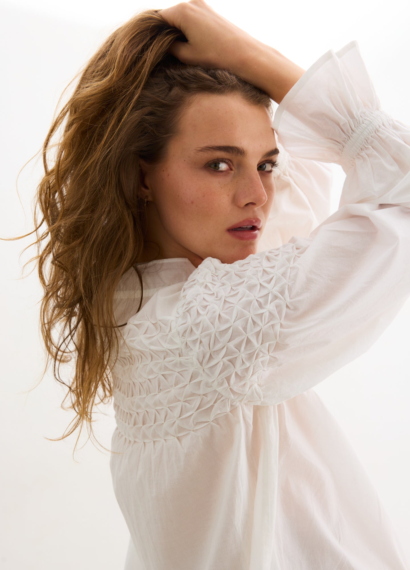 The Scarlett Smocked Top - Ivory maternity top with smocked bodice, long bishop sleeves, and nursing-friendly design.