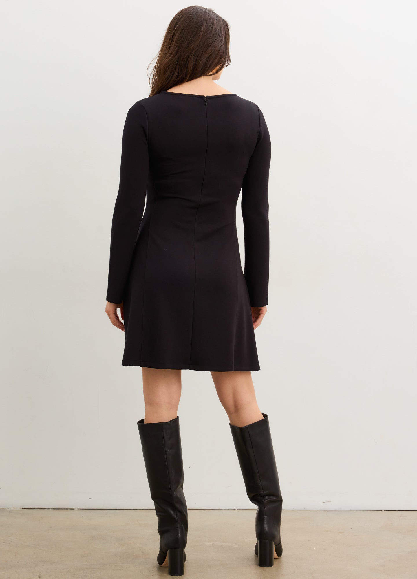 The Seamed Stretch Desk-To-Dinner Dress - Black long-sleeve stretch maternity dress with seamed waist, knee-length, styled for nursing and postpartum, paired with.