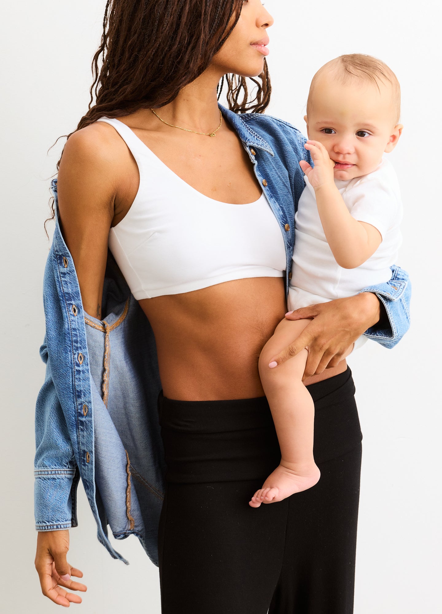 The Skin To Skin Bra - White maternity nursing bra with soft fabric, seamless design, and wide straps for pregnancy and postpartum support.