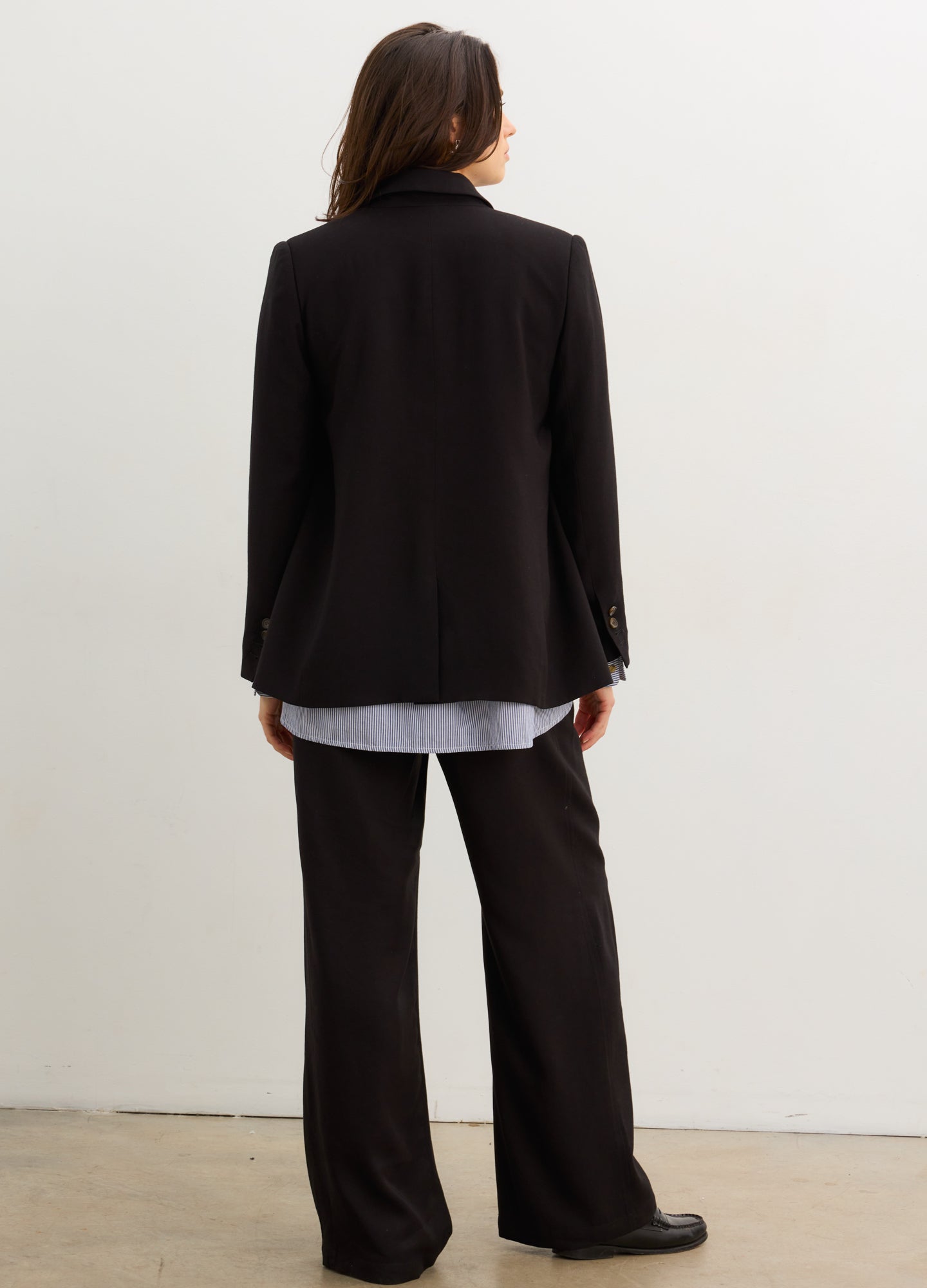 The Soft Tailored Twill Blazer - Black tailored twill blazer with double-button closure, designed for maternity, nursing, and postpartum wear.