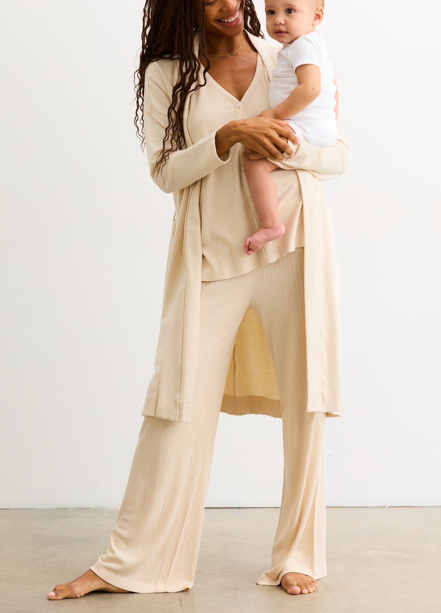 The Silky Ribbed Pointelle Easy Pant - Sand ribbed maternity pants with a relaxed fit, designed for pregnancy, nursing, and postpartum comfort.