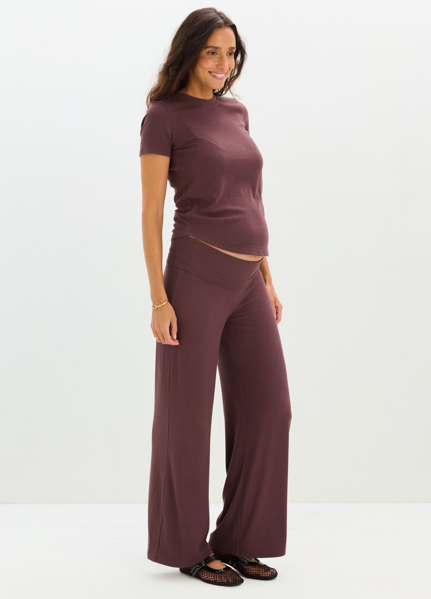 Maternity soft rib-knit lounge pants in deep mauve with wide legs and a relaxed fit.