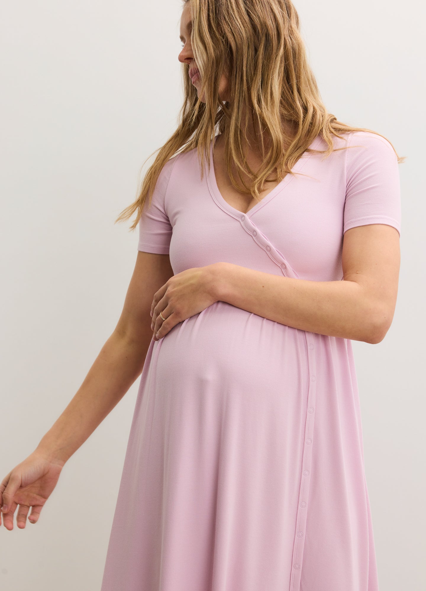 Light pink ribbed nursing maxi dress with short sleeves and side seam details, designed for maternity comfort.