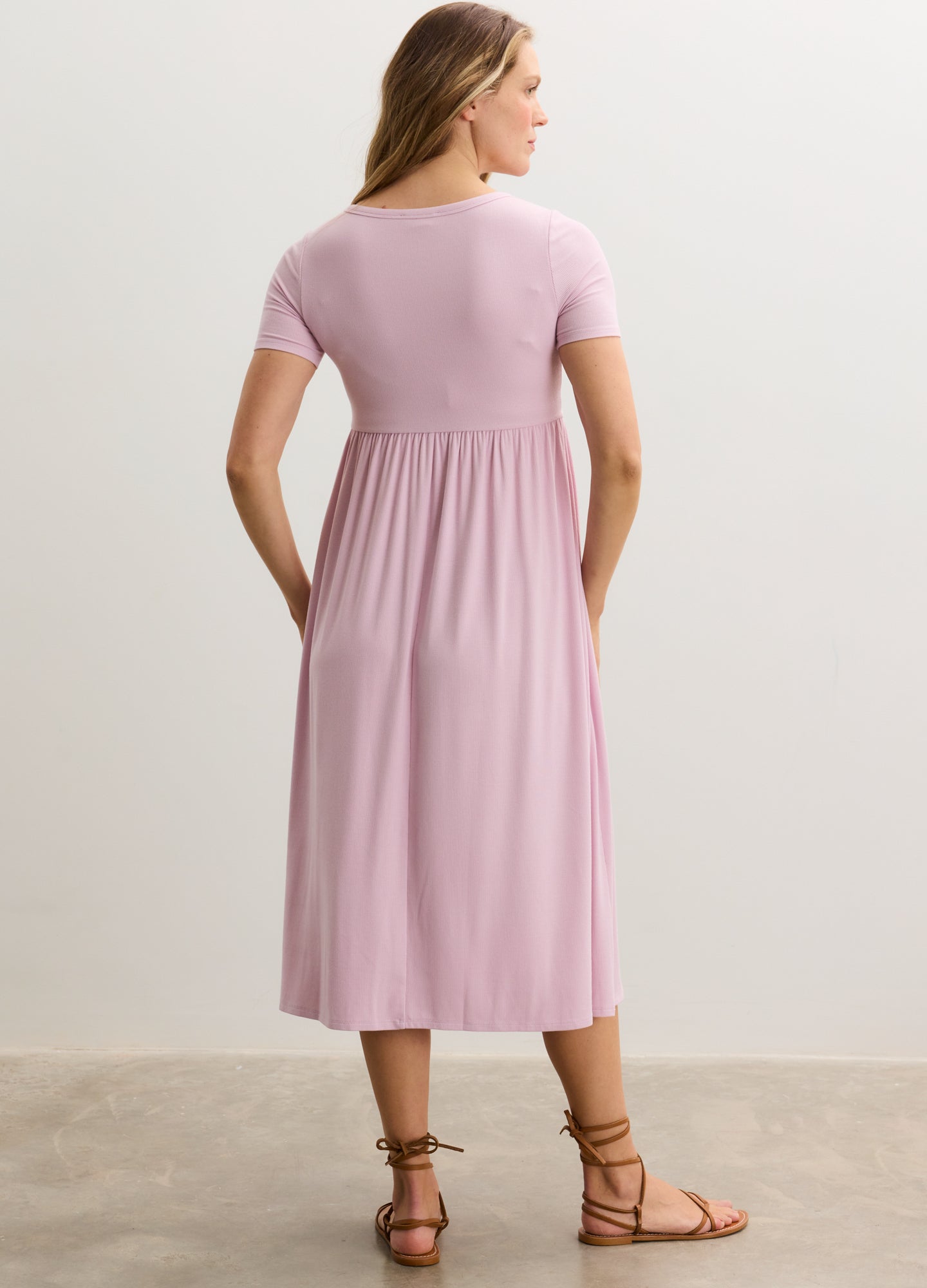 Soft pink ribbed nursing maxi dress with short sleeves and side seam detailing, flowy skirt.