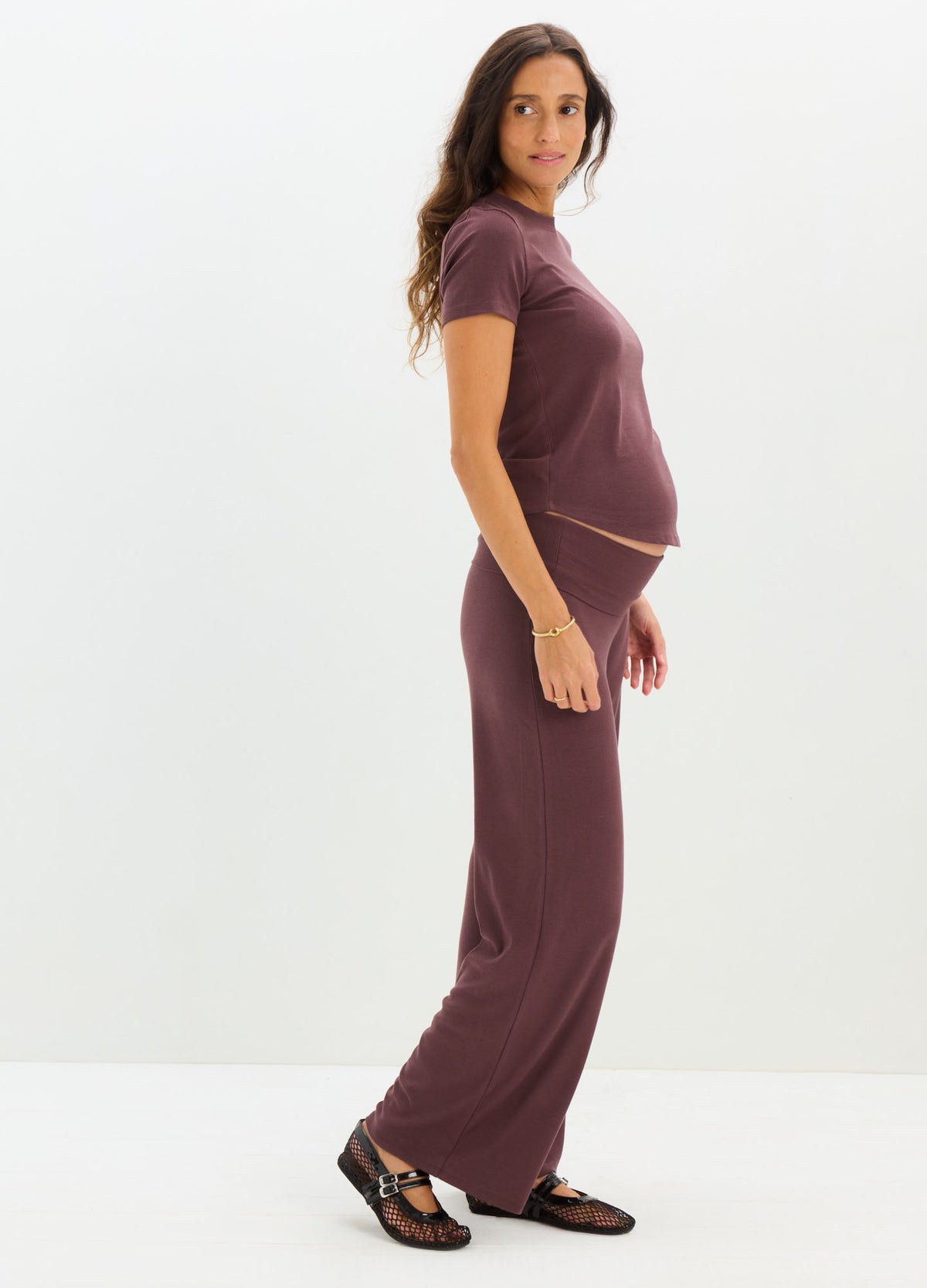 Maternity rib-knit tee and matching wide-leg pants in deep plum, soft stretchy fabric.