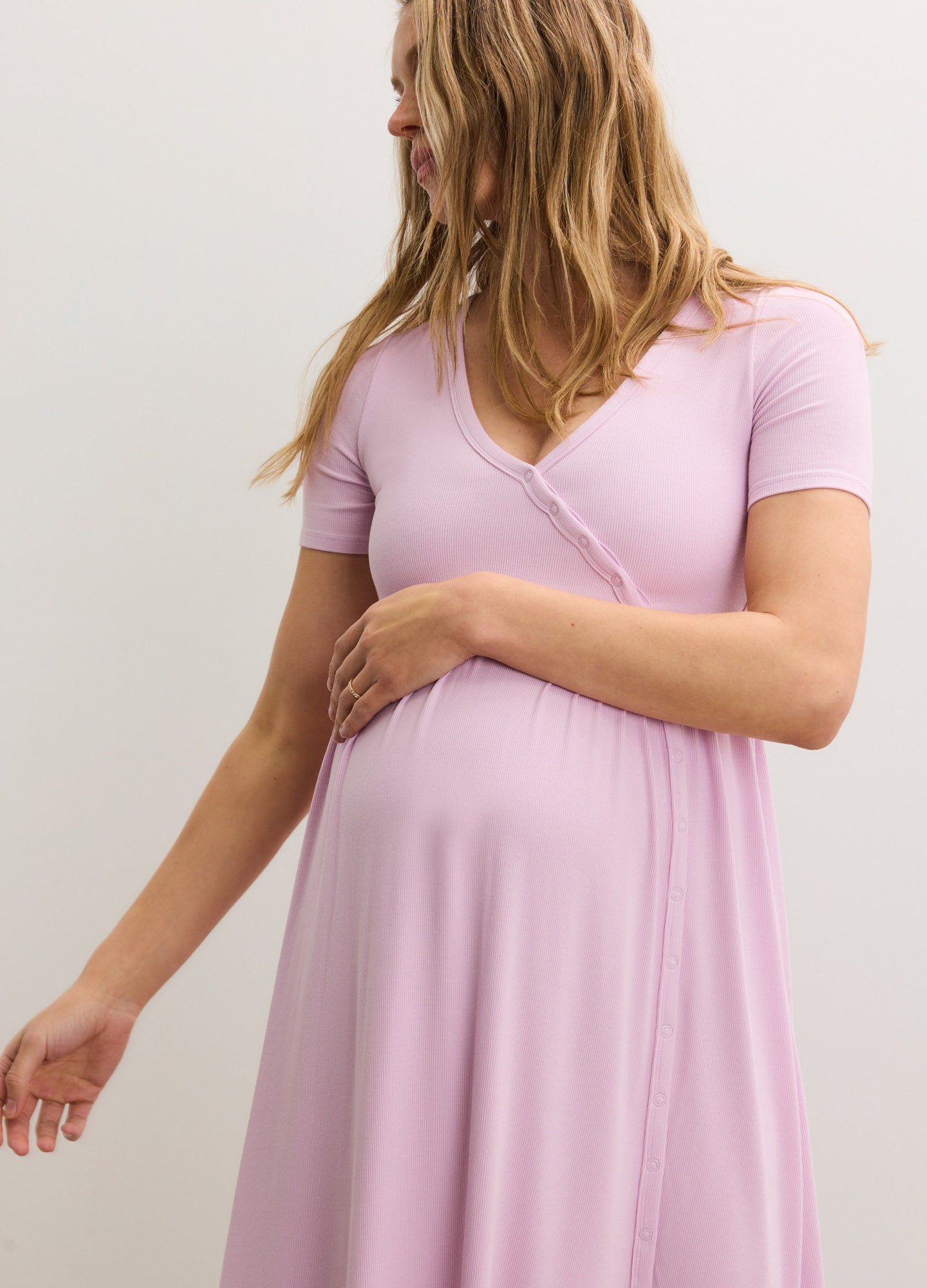 Light pink ribbed nursing maxi dress with short sleeves and side seam detail, designed for maternity and postpartum.