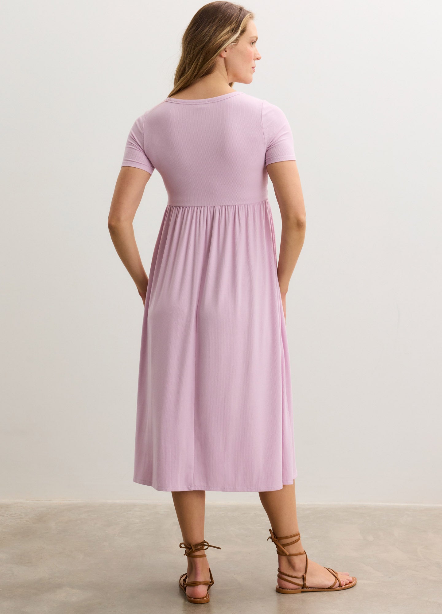 Light pink ribbed nursing maxi dress with short sleeves and side seam details, flowy fit.