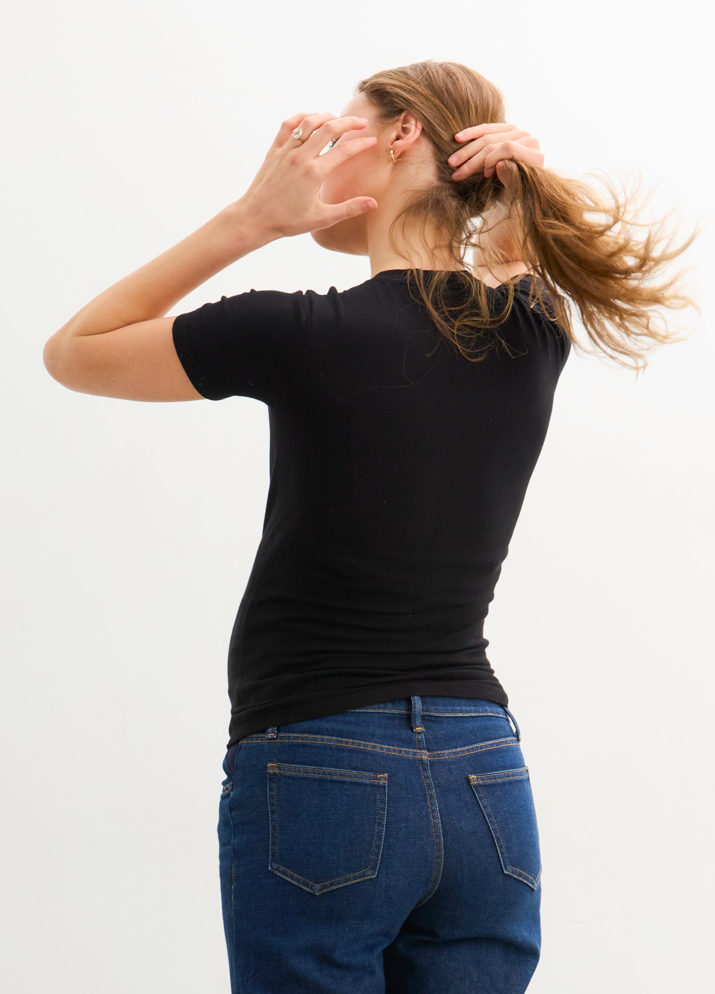 The Softsculpt Knit Tee - Black soft knit maternity tee with short sleeves, designed for pregnancy, nursing, and postpartum comfort.