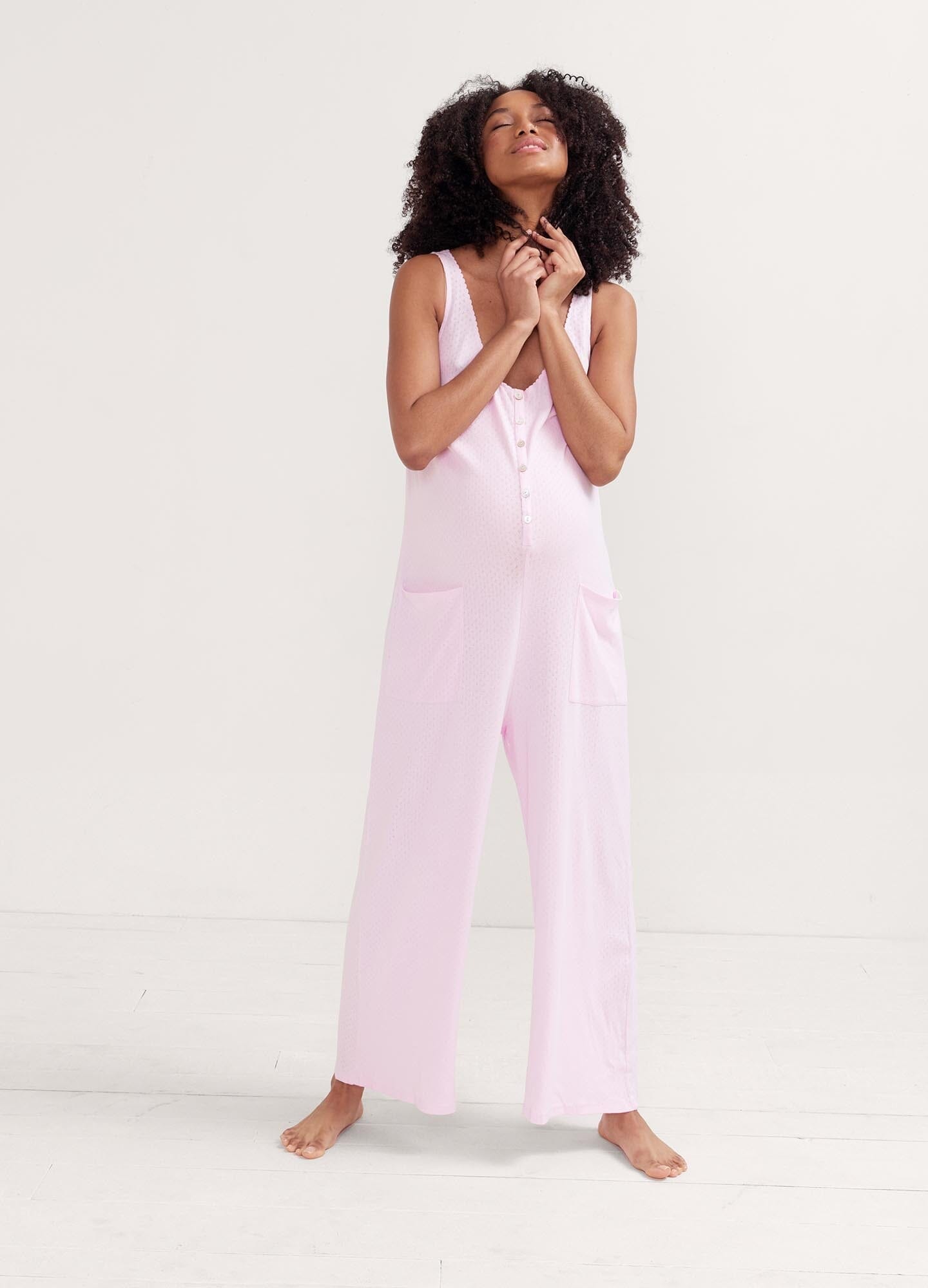 The 24/7 Feeding Jumpsuit POS - Lilac maternity jumpsuit with sleeveless V-neck, nursing-friendly front buttons, and wide-leg fit for postpartum comfort.