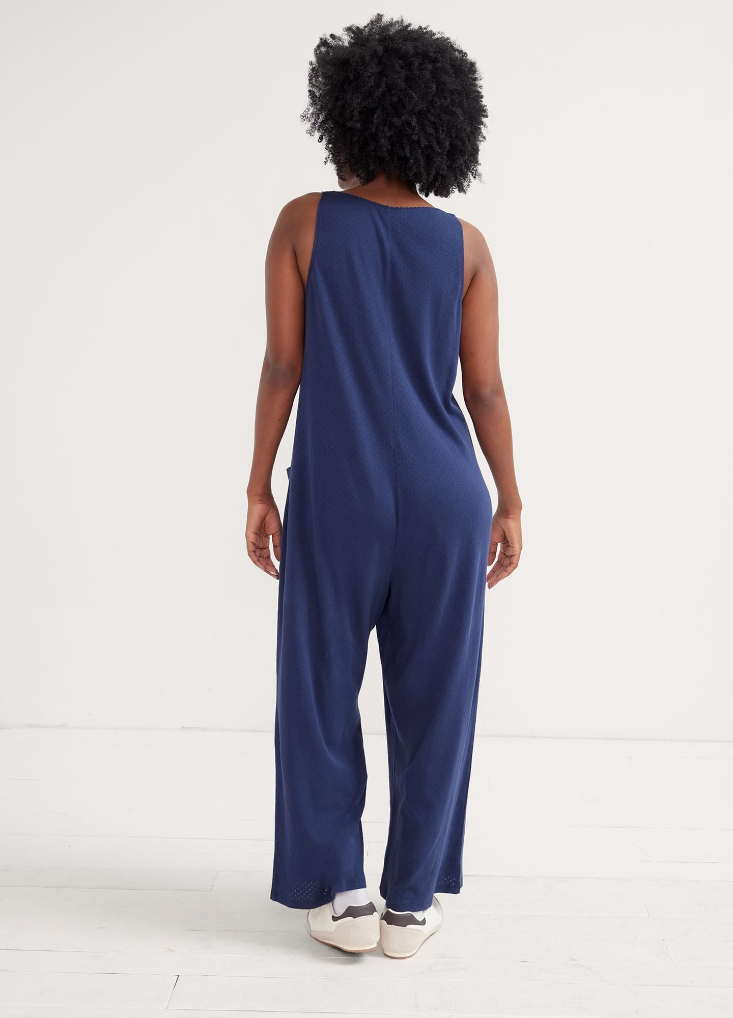 The 24/7 Feeding Jumpsuit POS - Lilac maternity jumpsuit with sleeveless V-neck, nursing-friendly front buttons, and wide-leg fit for postpartum comfort.