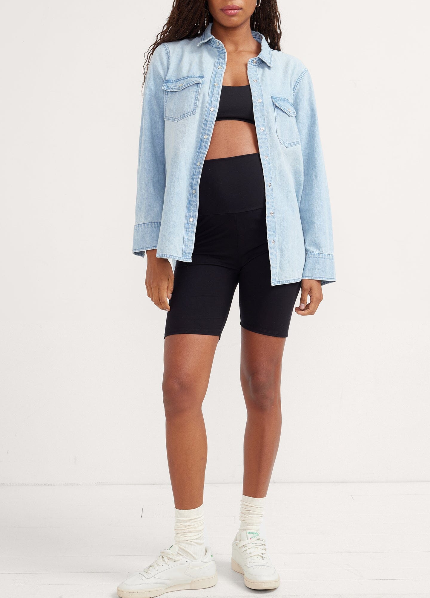 The Ultimate Before, During & After Bike Short - Black high-waisted maternity bike shorts with supportive panel, styled for pregnancy, nursing, and postpartum comfort.