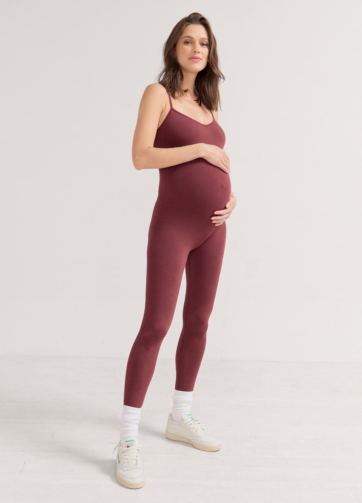 The Body Rib Unitard - Grey melange ribbed unitard with spaghetti straps designed for maternity, nursing, and postpartum comfort.