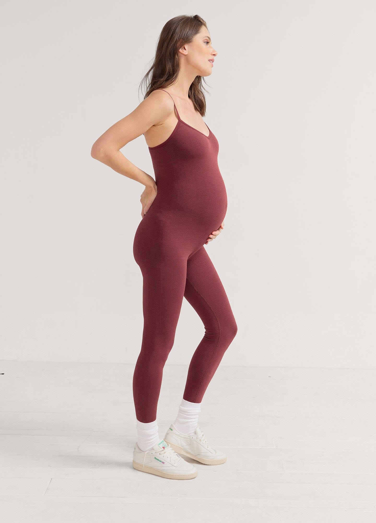 The Body Rib Unitard - Grey melange ribbed unitard with spaghetti straps designed for maternity, nursing, and postpartum comfort.