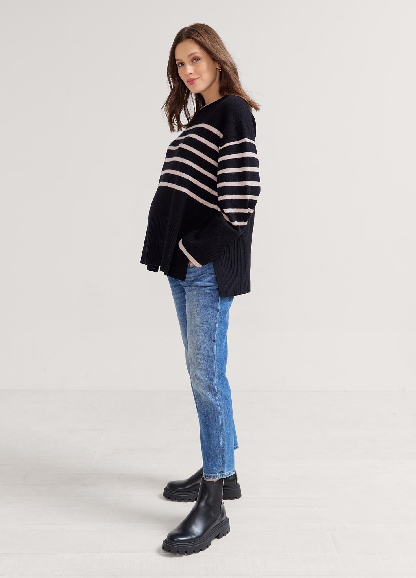 The Carly Knit Pullover - Black and oat melange striped knit pullover with side slits, designed for maternity, nursing, and postpartum comfort.
