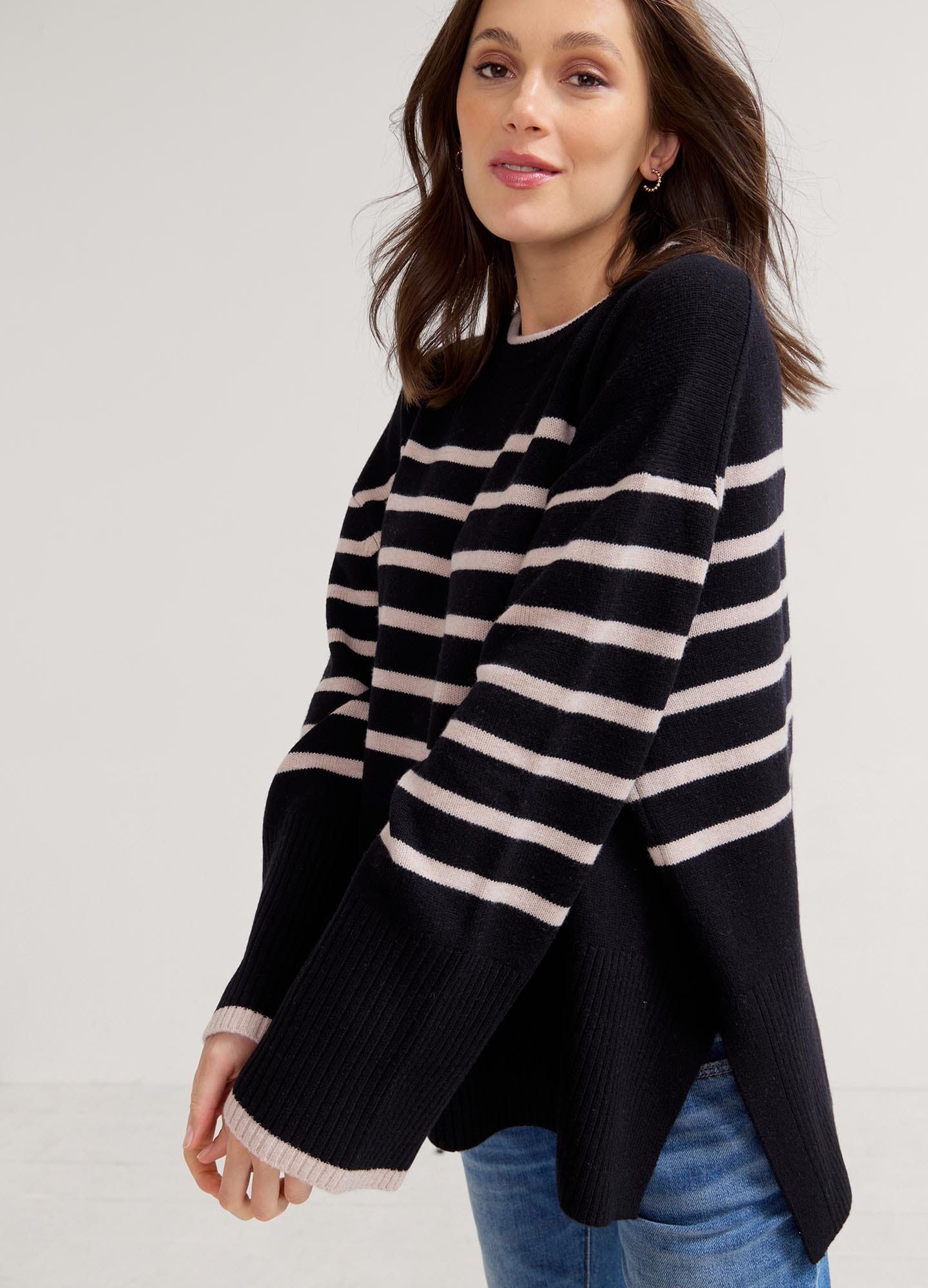 The Carly Knit Pullover - Black and oat melange striped knit pullover with side slits, designed for maternity, nursing, and postpartum comfort.