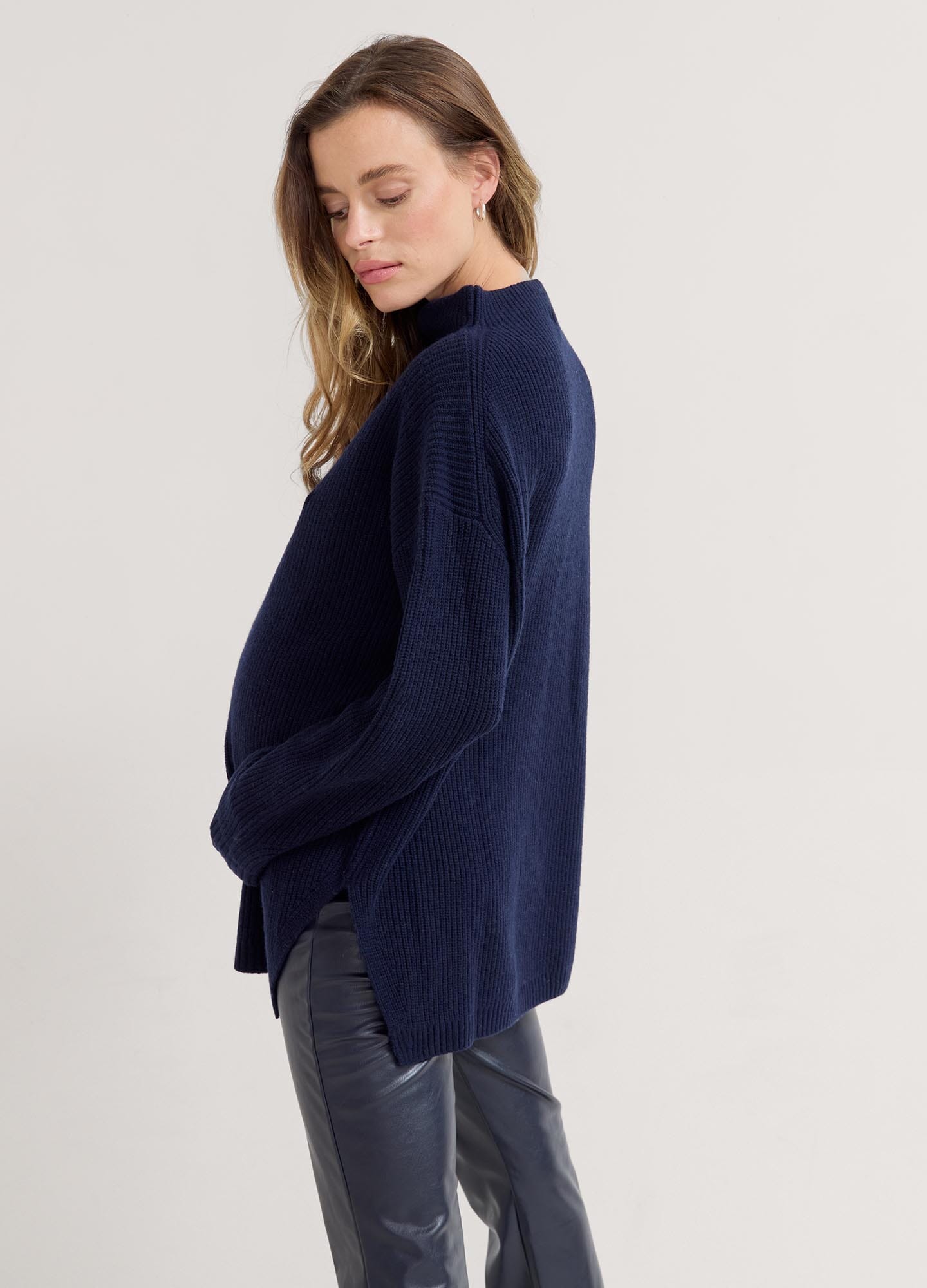 The Cozy Shaker Turtleneck - Navy blue cozy maternity turtleneck sweater with long sleeves, designed for nursing and postpartum comfort.