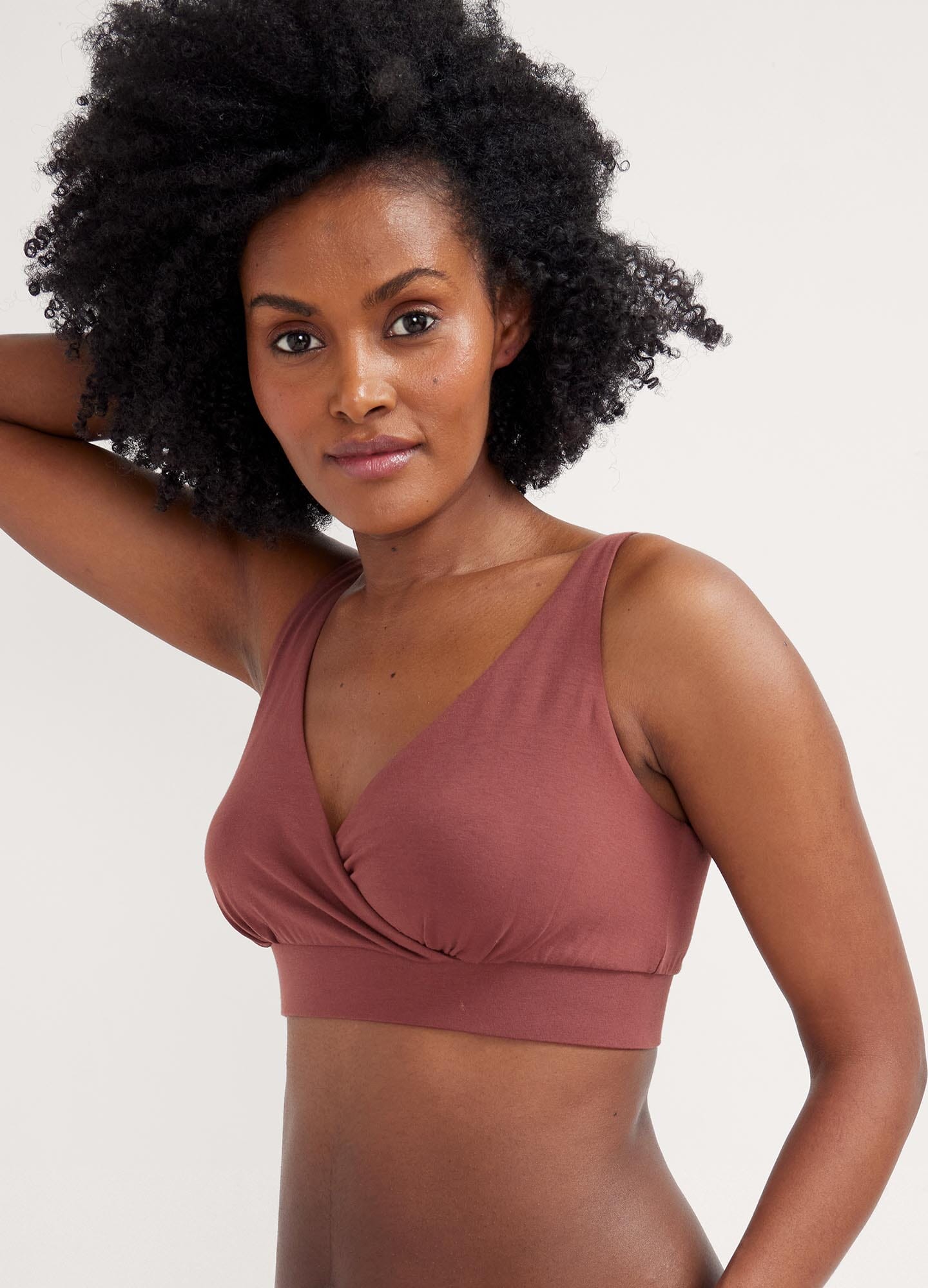 The Dream Feed Nursing And Sleep Bra - Soft, stretchy anise maternity nursing bra with easy-access clips, modeled during postpartum and nursing moments.