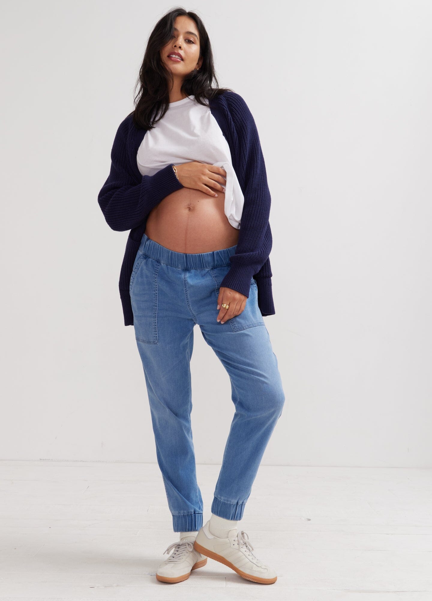 The Easy Denim Jogger - Faded indigo maternity denim joggers with elastic waistband, styled for pregnancy and postpartum comfort.