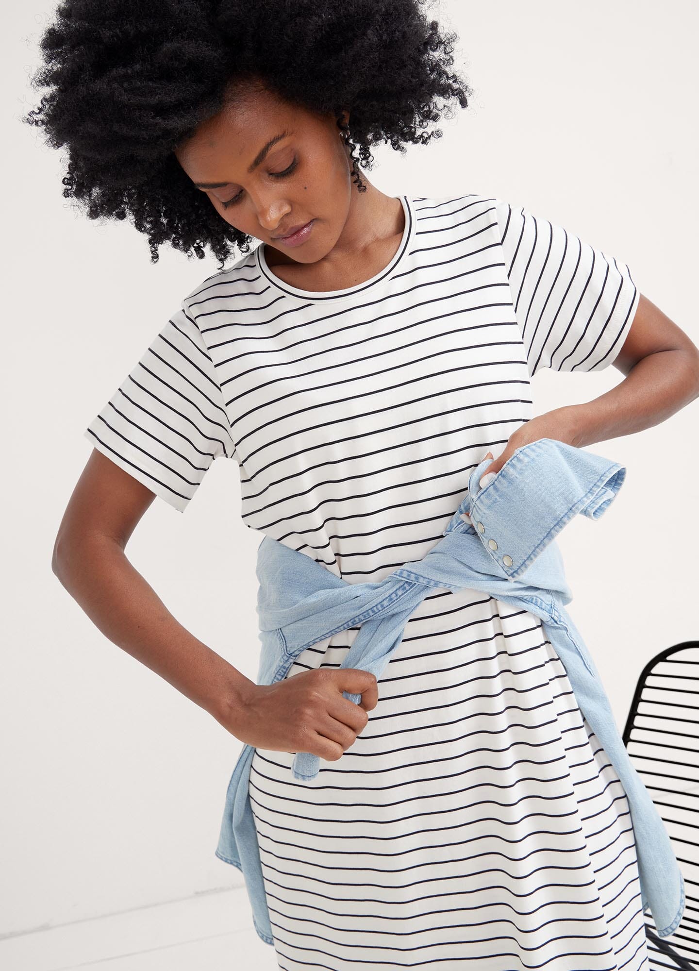 The Easy Going Nursing Tee Dress - Black and white striped nursing tee dress with short sleeves, designed for maternity, pregnancy, and postpartum comfort.