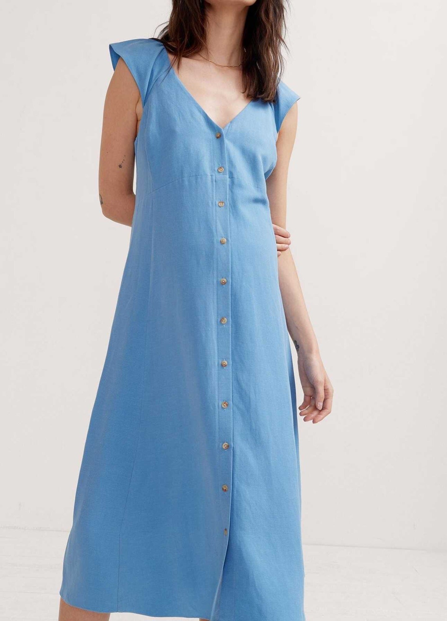 The Jules Dress - Light blue sleeveless maternity dress with V-neck and button-front design, ideal for nursing and postpartum.