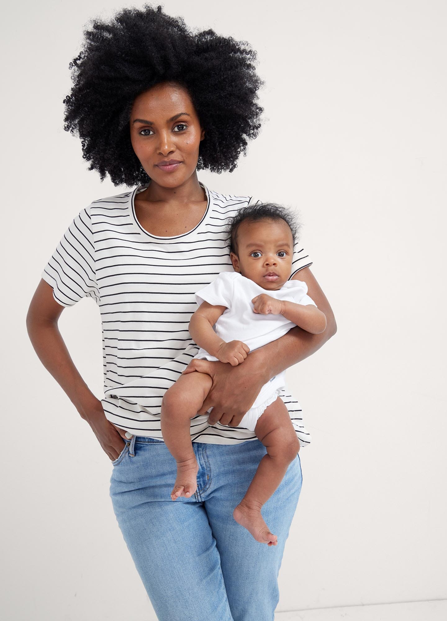 The Luxe Nursing Tee - White short-sleeve maternity nursing tee with scoop neckline, designed for pregnancy and postpartum comfort.