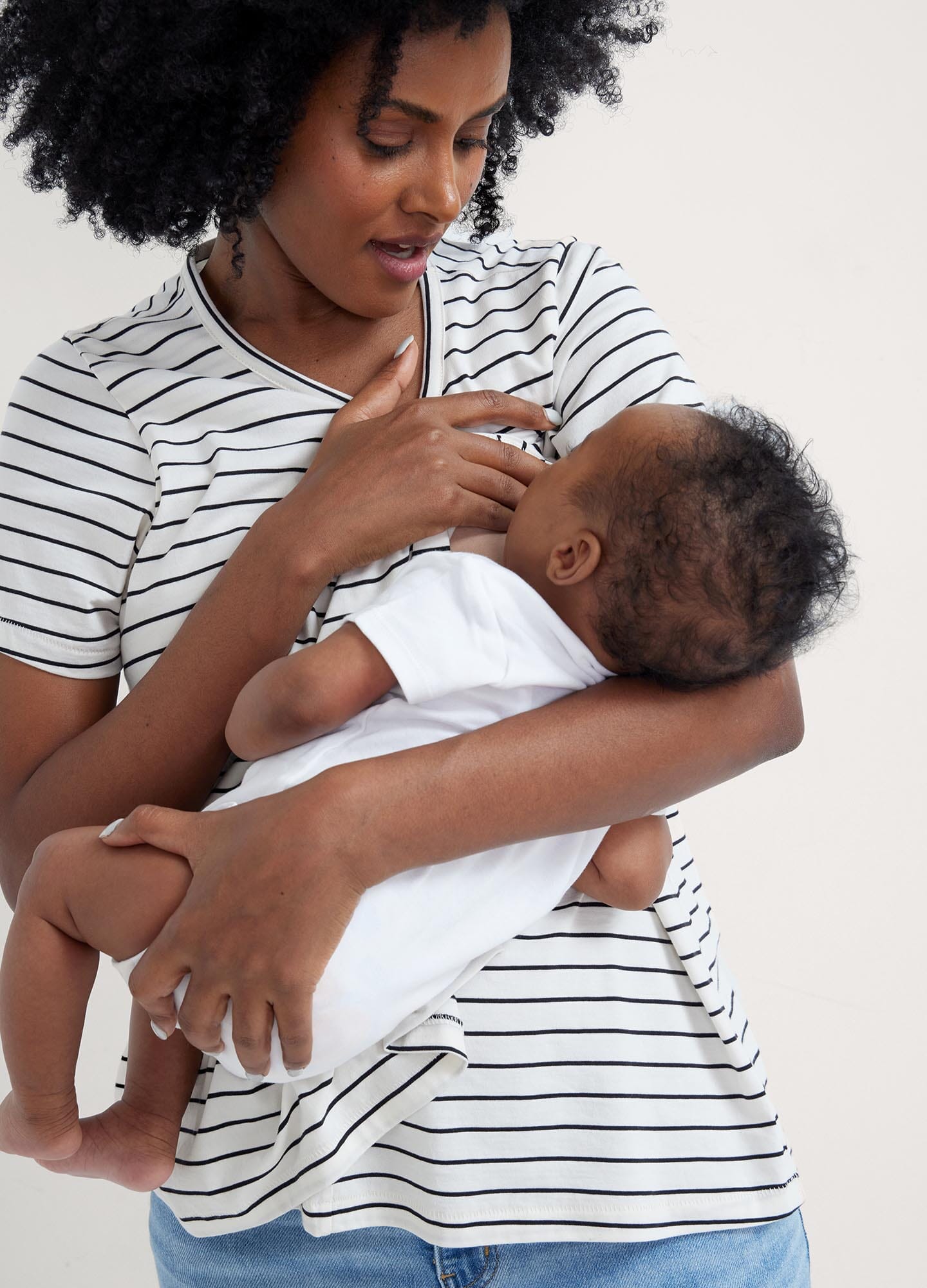 The Luxe Nursing Tee - White short-sleeve maternity nursing tee with scoop neckline, designed for pregnancy and postpartum comfort.