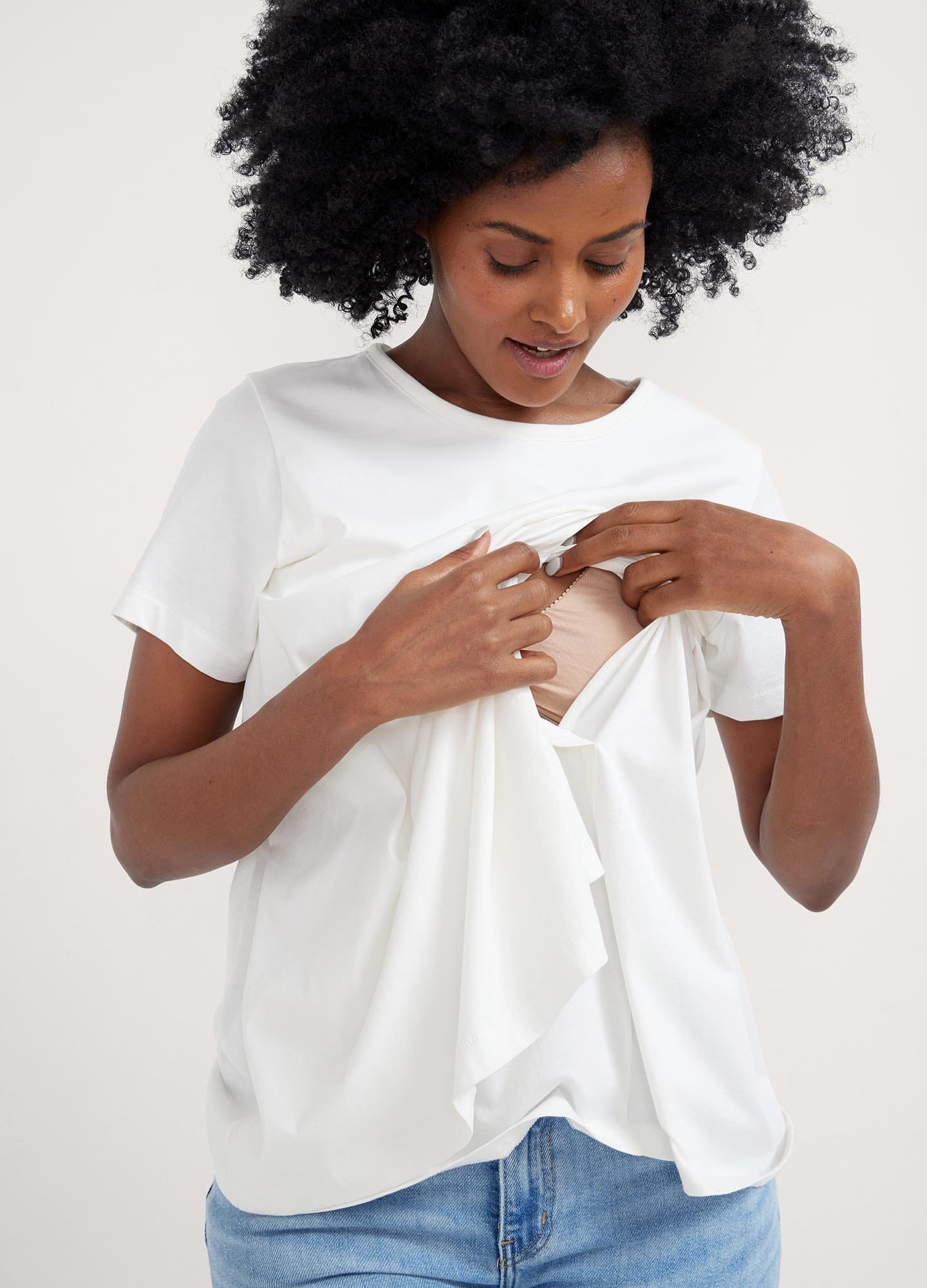 The Luxe Nursing Tee - White short-sleeve maternity nursing tee with scoop neckline, designed for pregnancy and postpartum comfort.