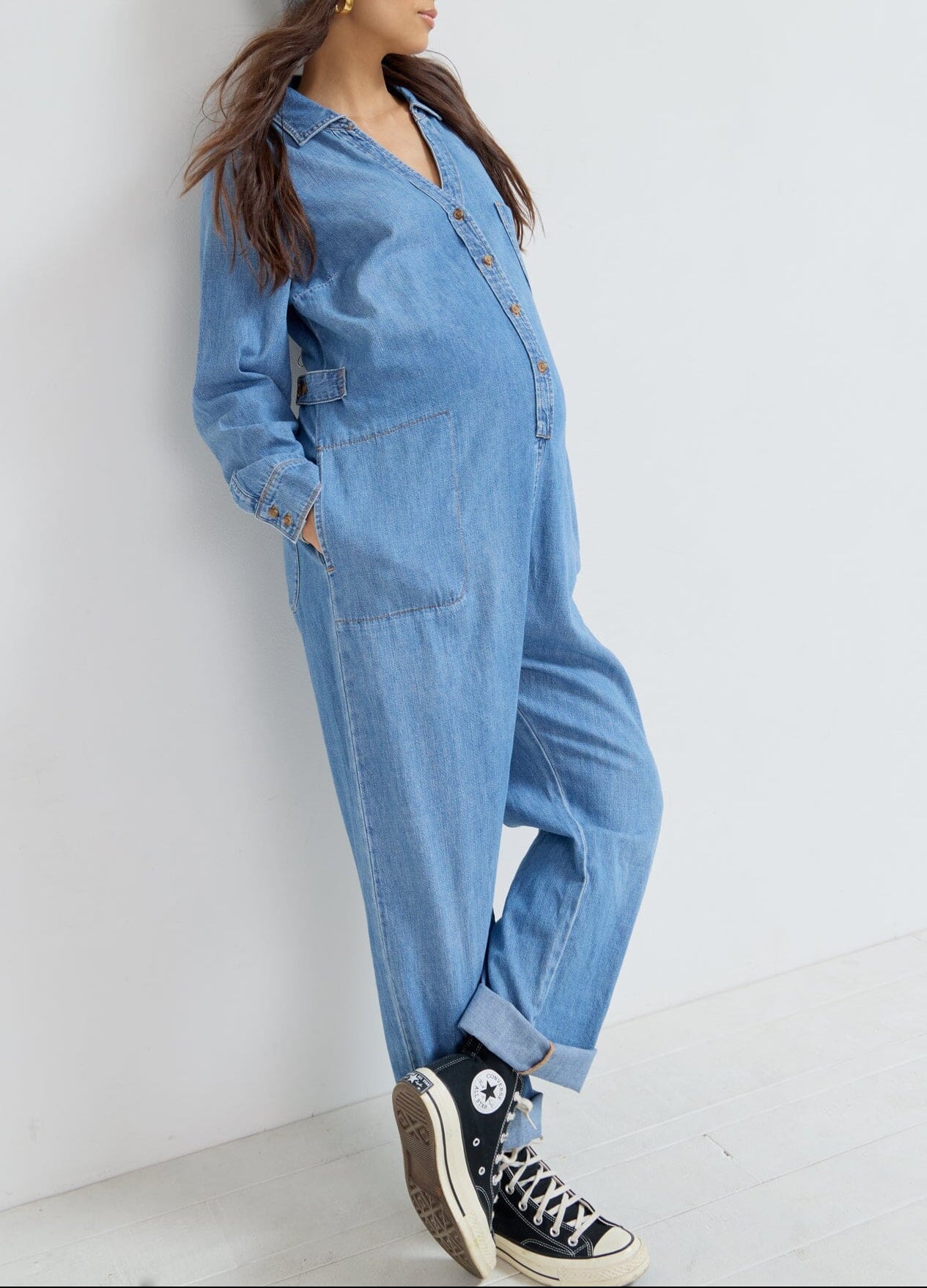 The Everyday Nursing Denim Jumpsuit - Indigo denim maternity jumpsuit with long sleeves and nursing access, designed for pregnancy and postpartum comfort.