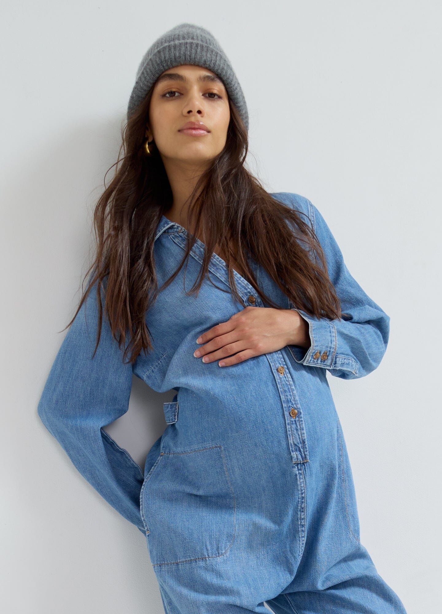 The Everyday Nursing Denim Jumpsuit - Indigo denim maternity jumpsuit with long sleeves and nursing access, designed for pregnancy and postpartum comfort.