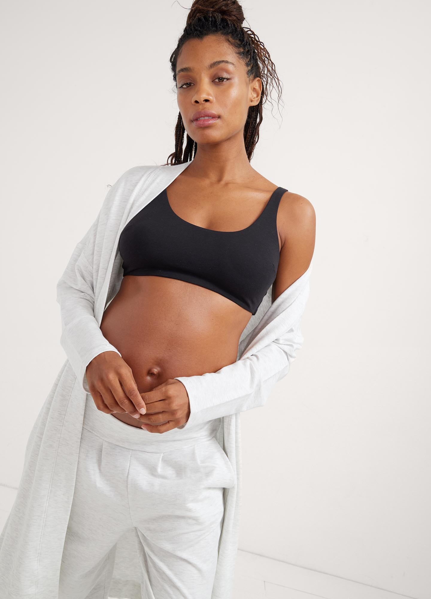 The Robe - Soft white maternity robe with waist tie, designed for pregnancy, nursing, and postpartum comfort.