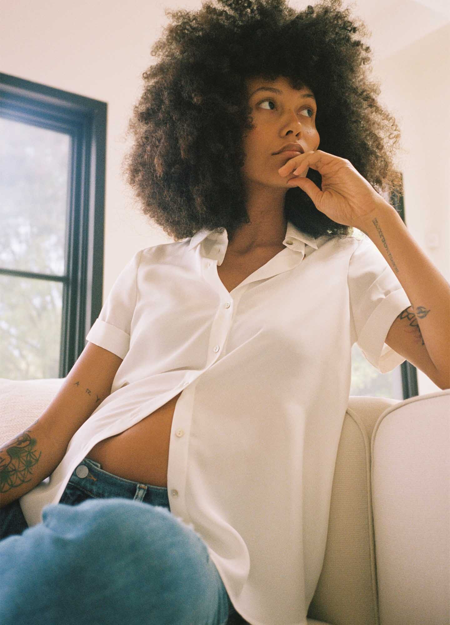 The Savannah Top - Black maternity top with short sleeves, notch collar, and front button closure for nursing and postpartum.