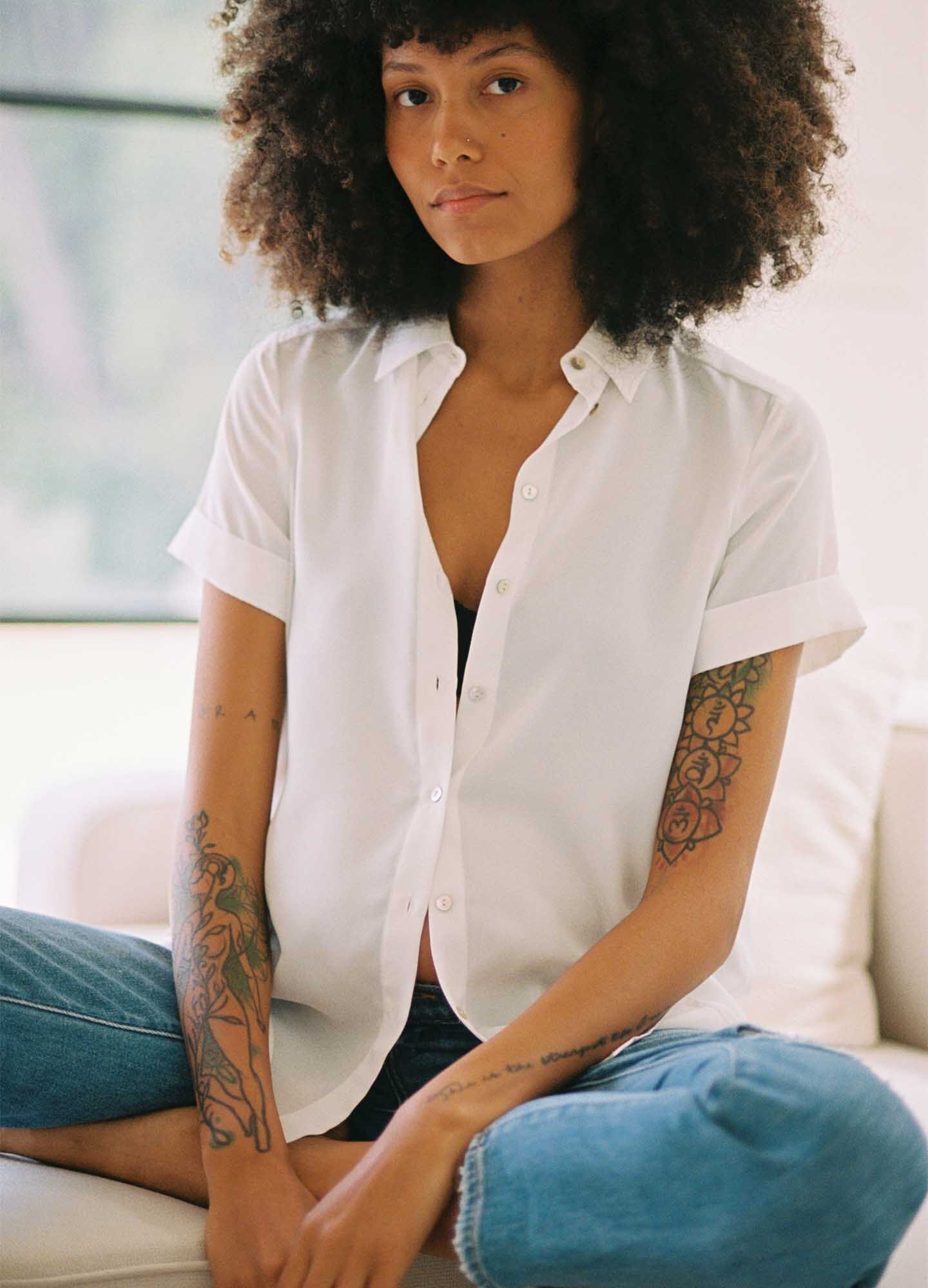 The Savannah Top - Black maternity top with short sleeves, notch collar, and front button closure for nursing and postpartum.