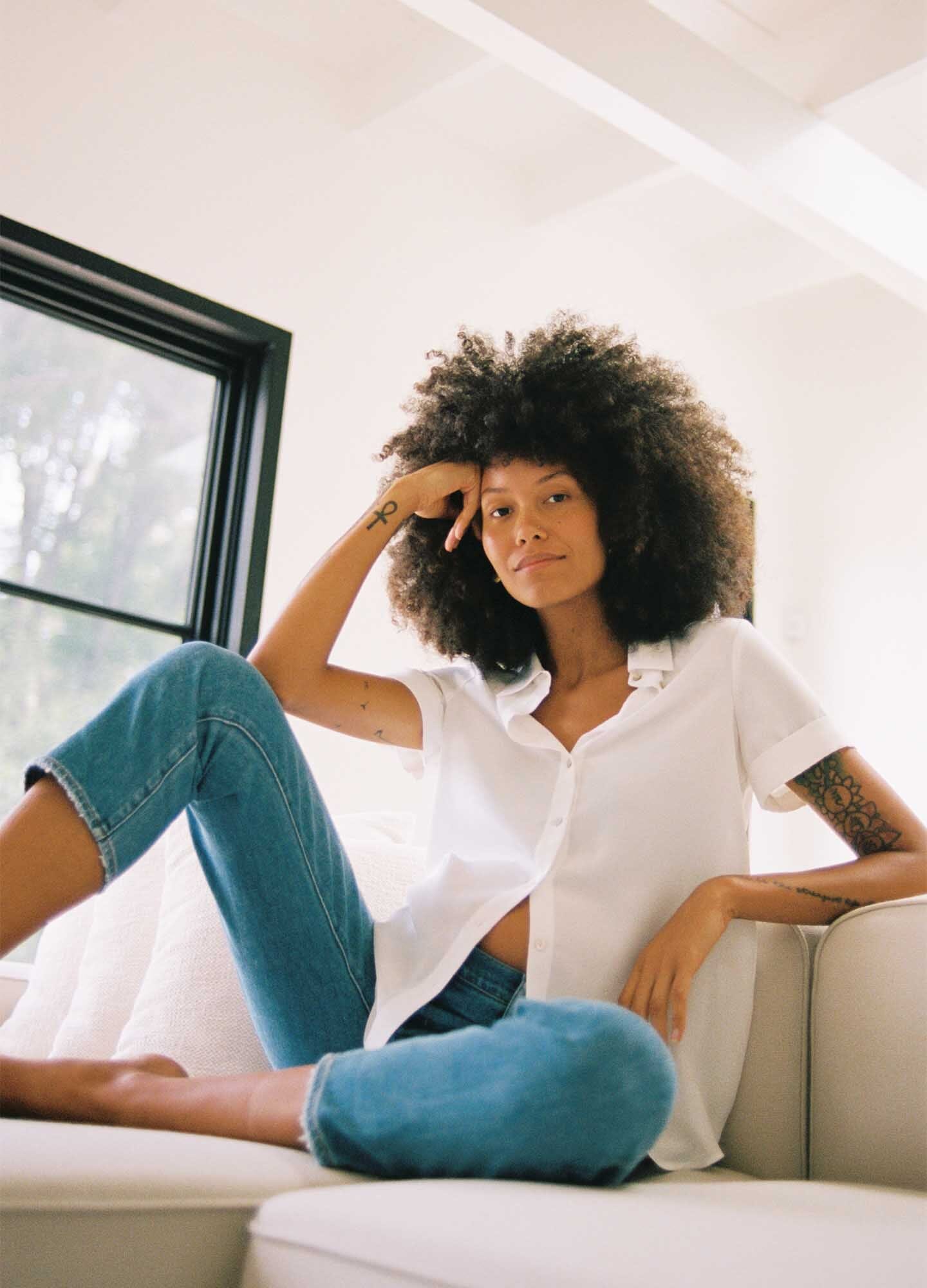 The Savannah Top - Black maternity top with short sleeves, notch collar, and front button closure for nursing and postpartum.