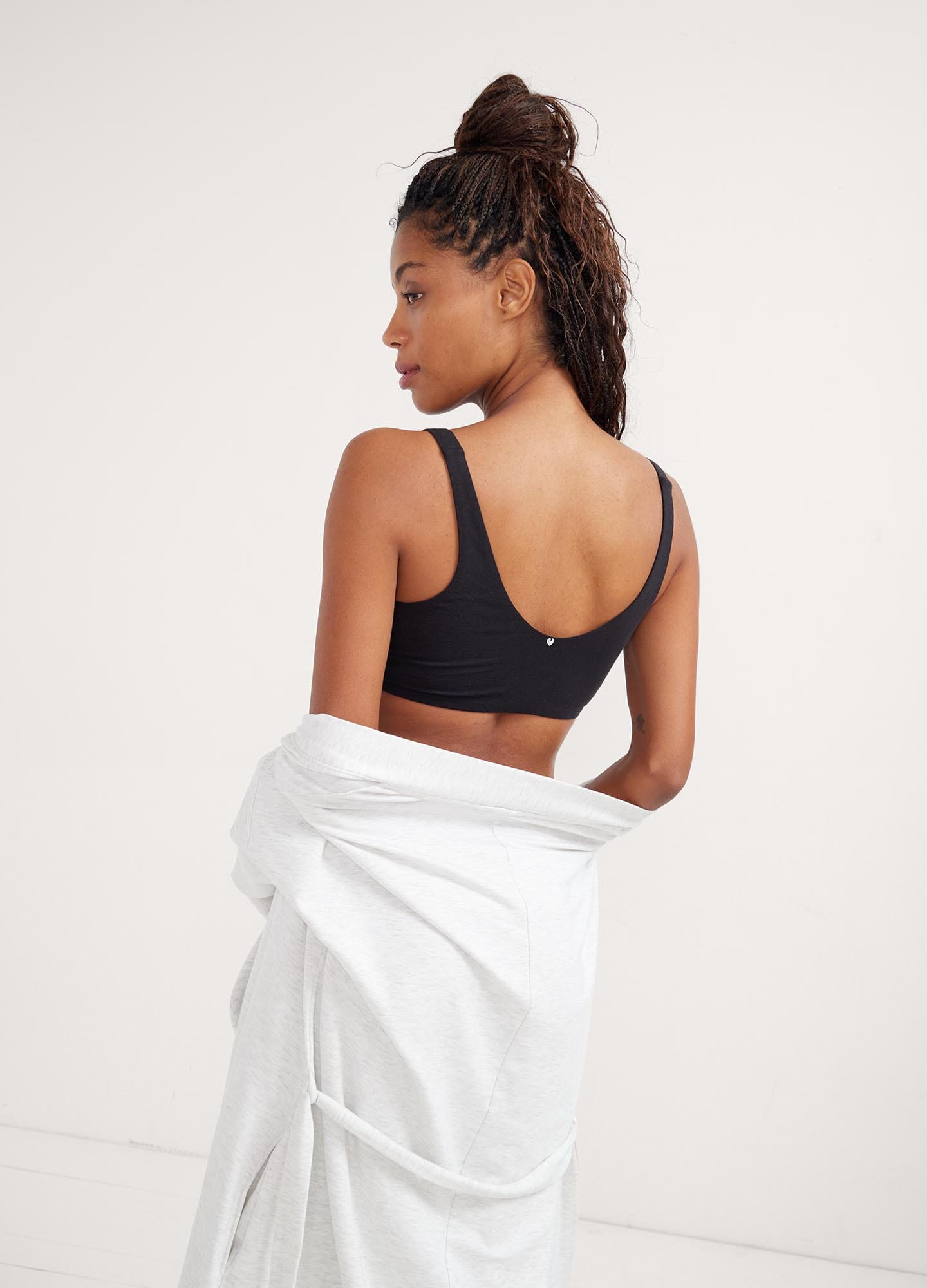 The Skin To Skin Bra - Black maternity nursing bra with seamless design and scoop neckline, ideal for pregnancy and postpartum.