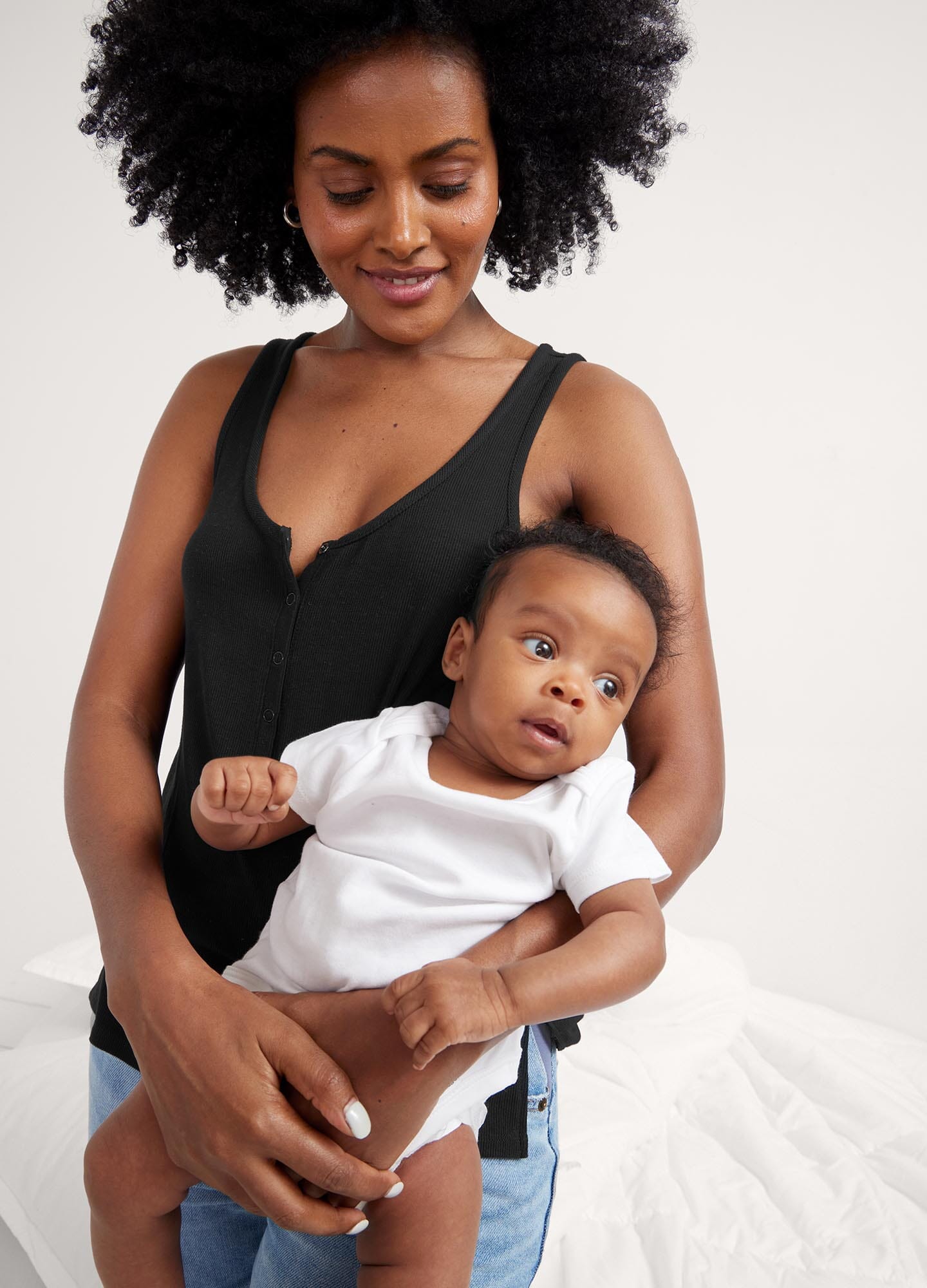 The Softest Rib Nursing Tank - Black ribbed nursing tank with scoop neckline and racerback, styled for maternity, pregnancy, and postpartum comfort.