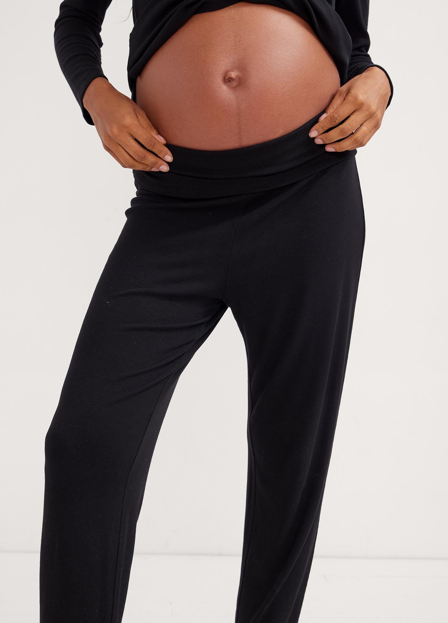 The Softest Rib Over/Under Lounge Pant - Black ribbed lounge pants with over/under waistband modeled for maternity, pregnancy, nursing, and postpartum comfort.