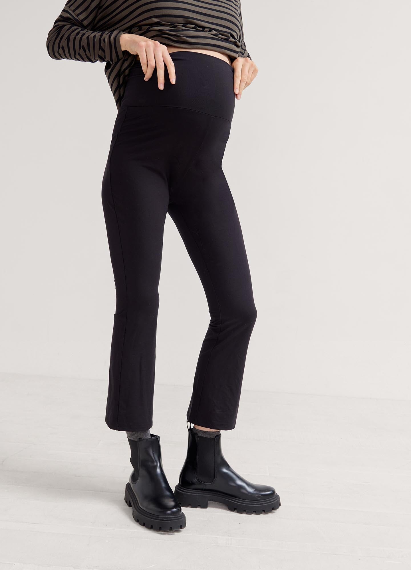 The Ultimate Before, During & After Crop Flare - Black maternity flare pants with side slits, designed for pregnancy, nursing, and postpartum.