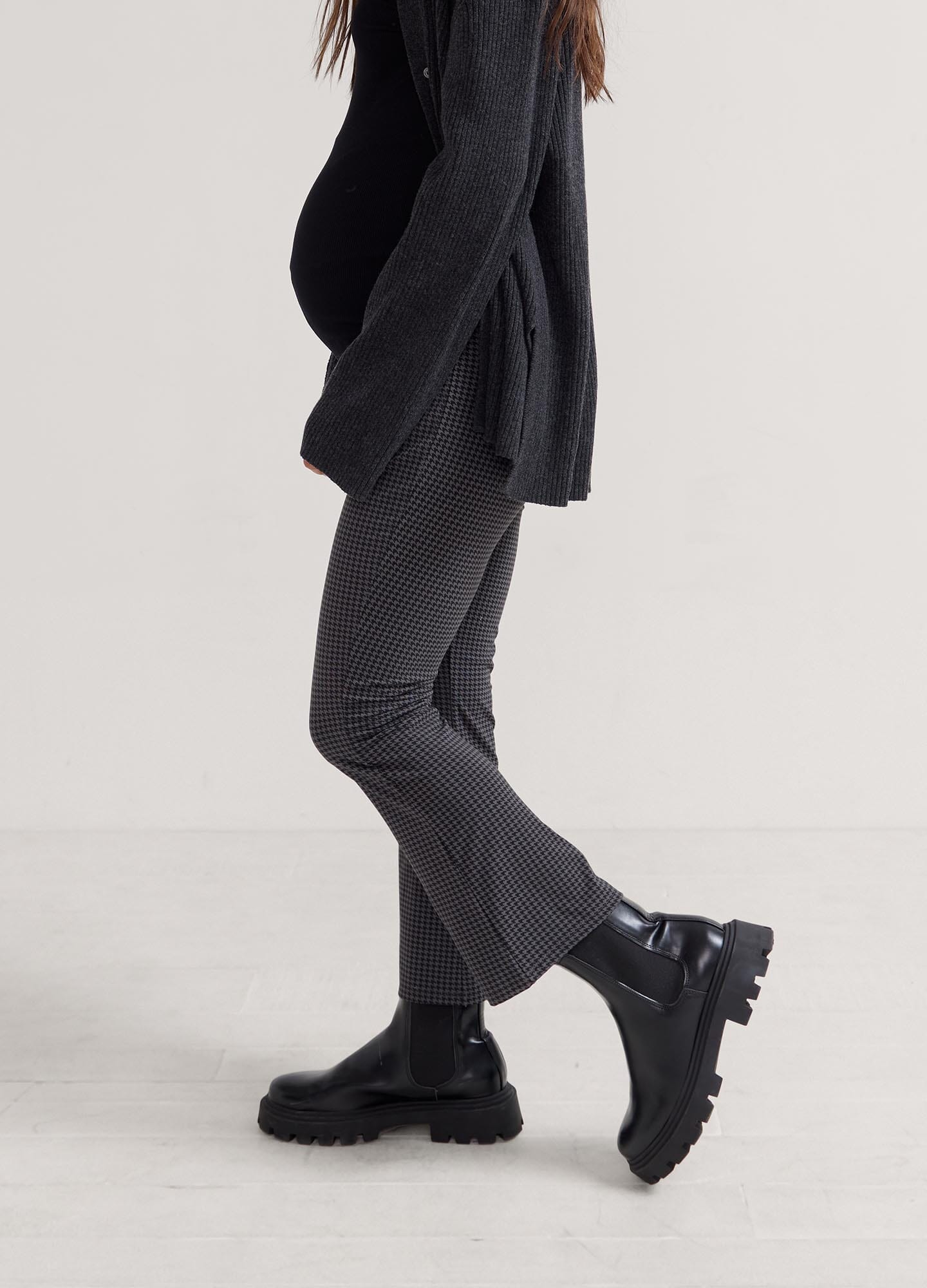 The Ultimate Before, During & After Crop Flare - Black maternity flare pants with side slits, designed for pregnancy, nursing, and postpartum.