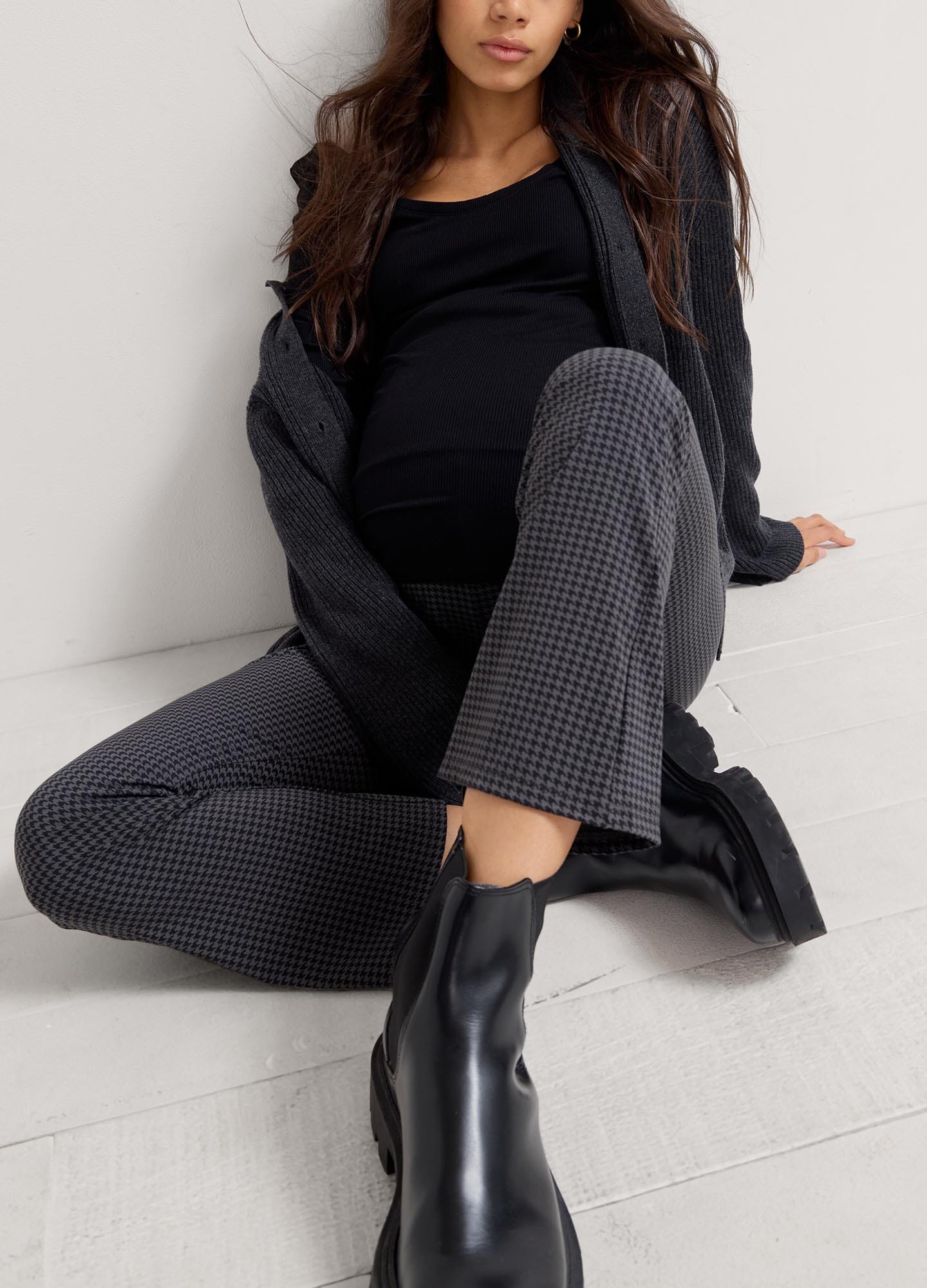 The Ultimate Before, During & After Crop Flare - Black maternity flare pants with side slits, designed for pregnancy, nursing, and postpartum.