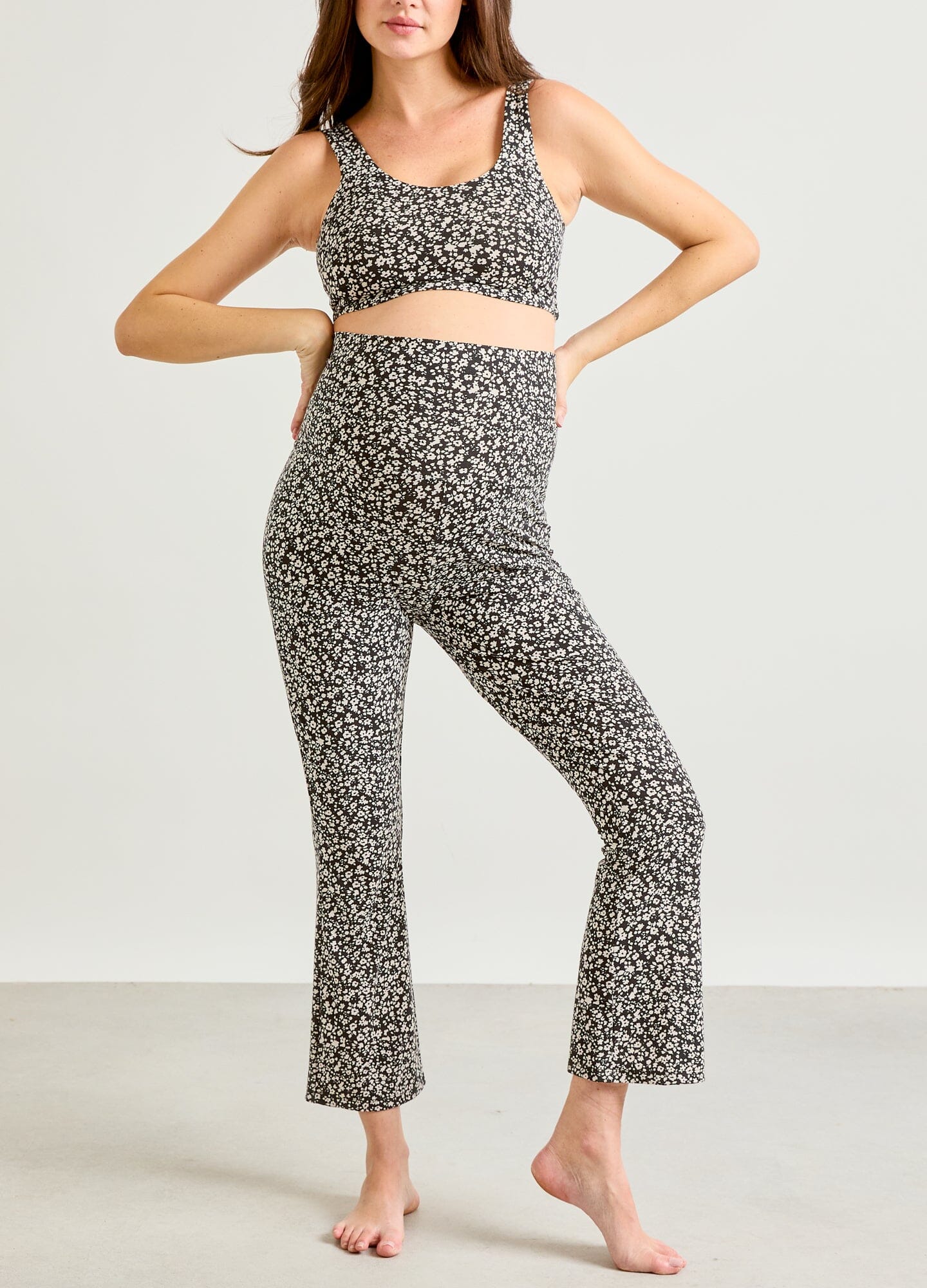 The Ultimate Before, During & After Crop Flare - Black and white abstract floral maternity crop top and high-waist leggings designed for pregnancy, nursing, and postpartum.
