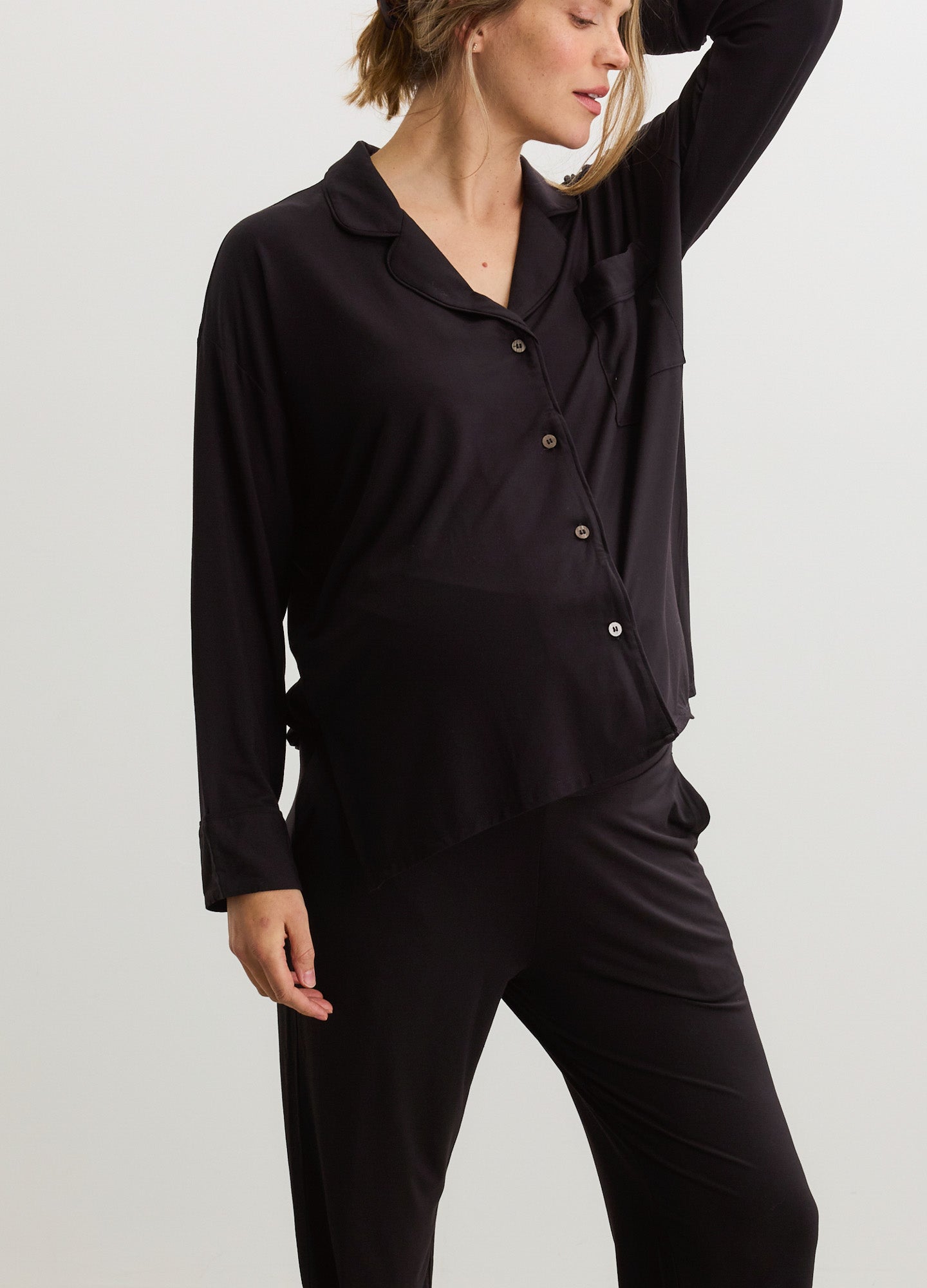 Black soft jersey maternity pajama set with button-up long sleeve top and elastic waist pants.