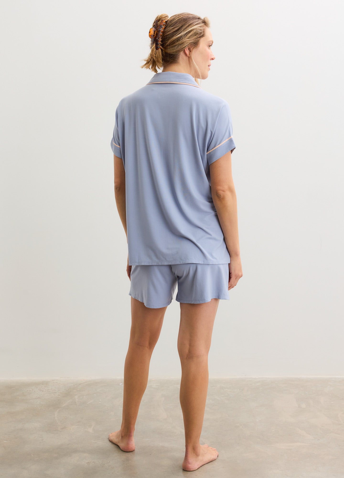 Light blue short-sleeve maternity pajama top and matching shorts in soft jersey fabric.
