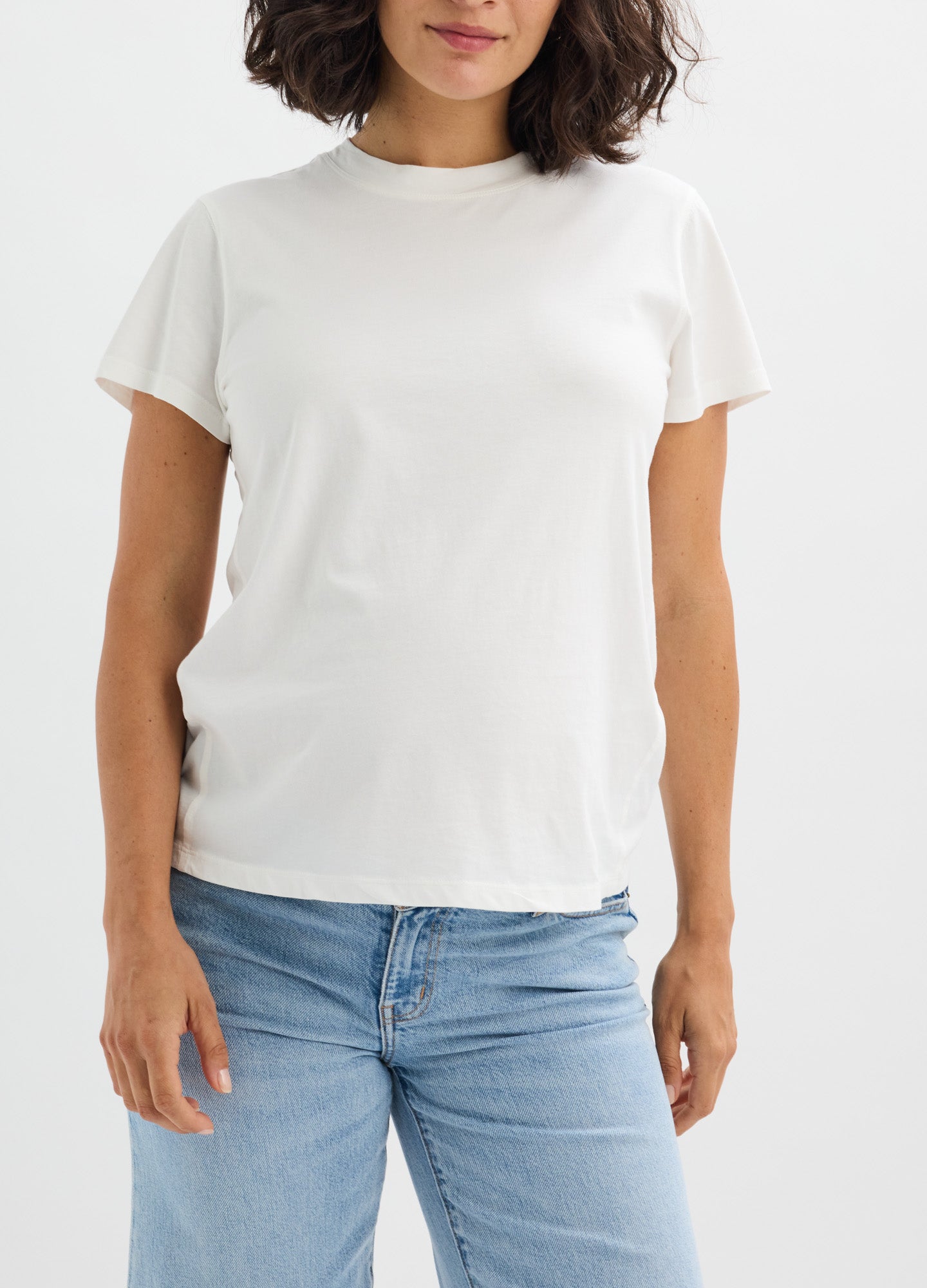 White washed cotton short sleeve crew neck maternity t-shirt with relaxed fit and soft texture.