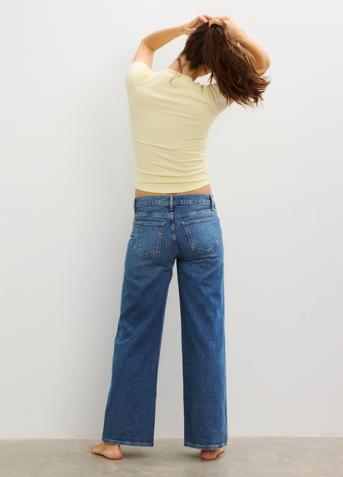 Blue wide-leg maternity jeans with relaxed fit and stretchy waistband for pregnant comfort.